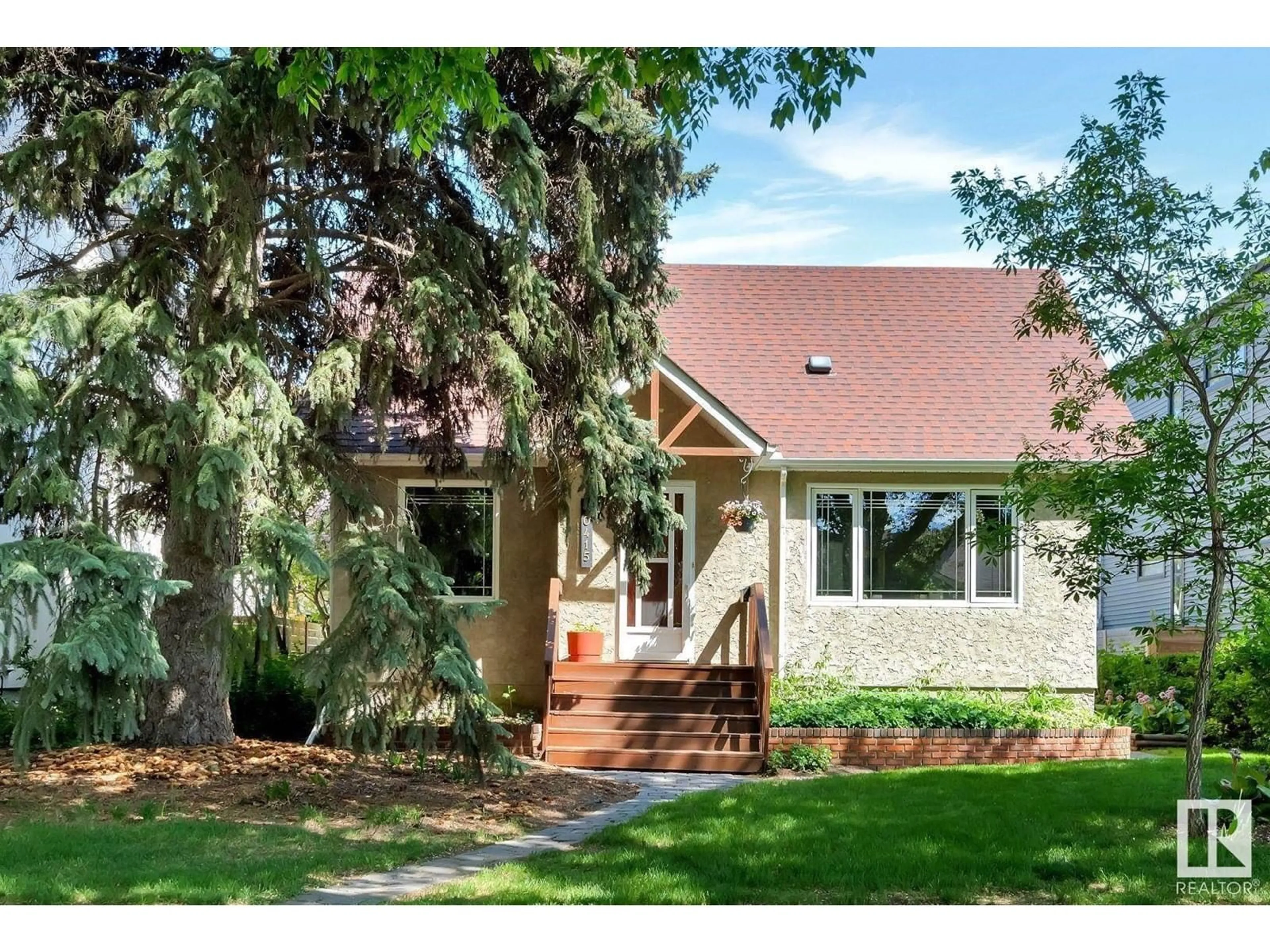 Home with vinyl exterior material, street for NW - 10415 144 ST, Edmonton Alberta T5N3G8