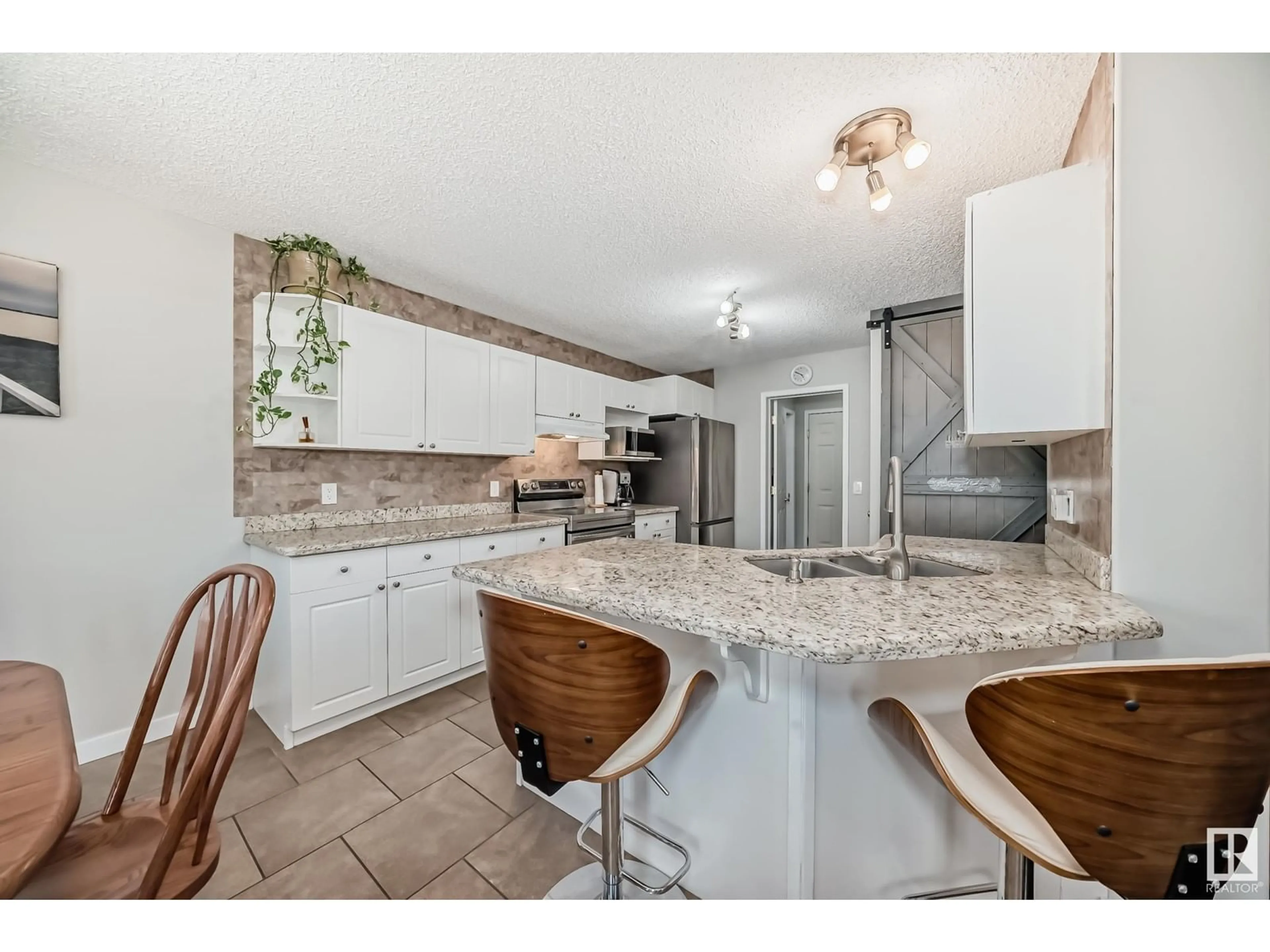 Open concept kitchen, ceramic/tile floor for 2854 41 AV, Edmonton Alberta T6T1M4