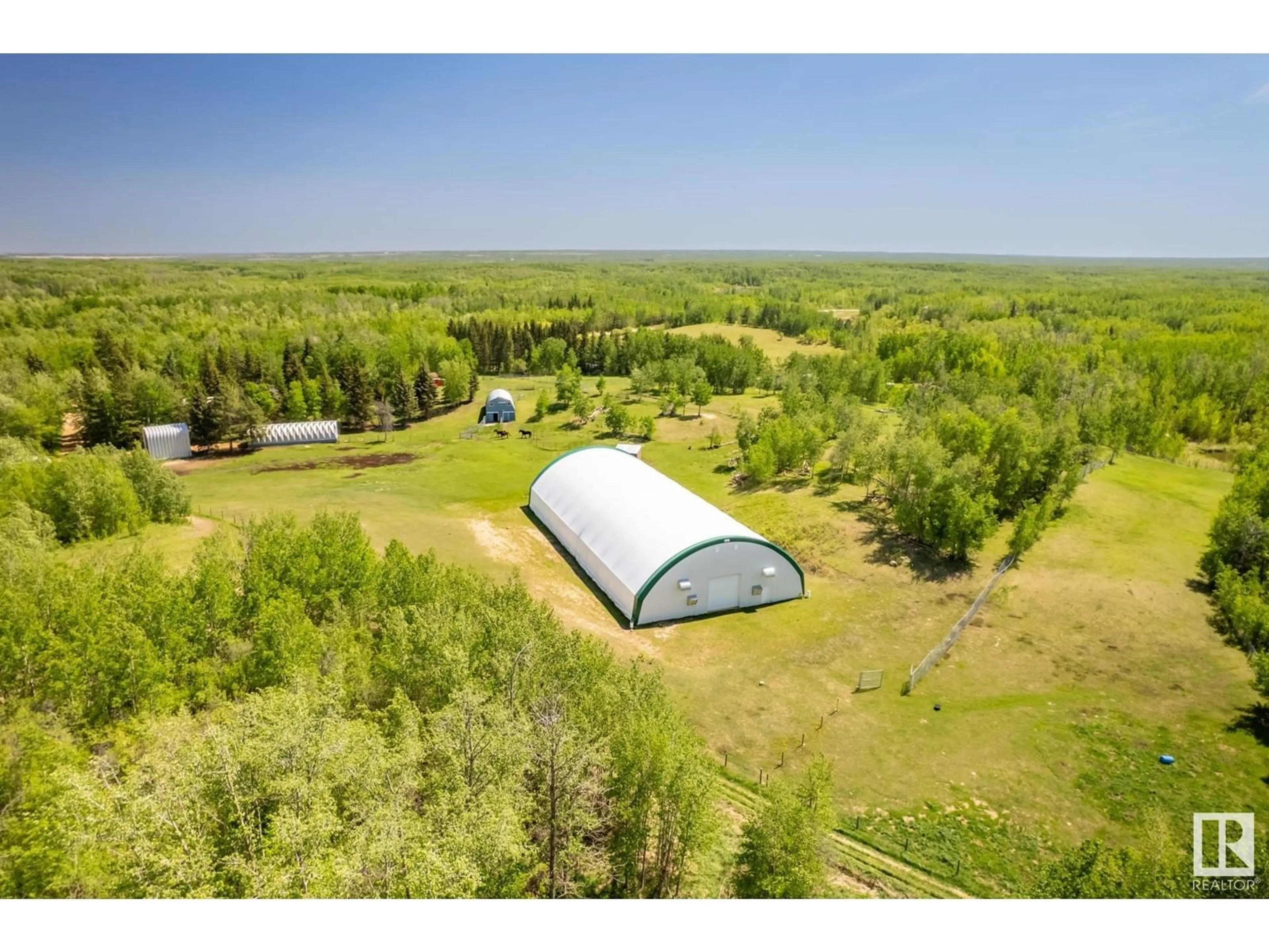 A pic from outside/outdoor area/front of a property/back of a property/a pic from drone, forest/trees view for 51030 RGE ROAD 203, Rural Strathcona County Alberta T8G1E4