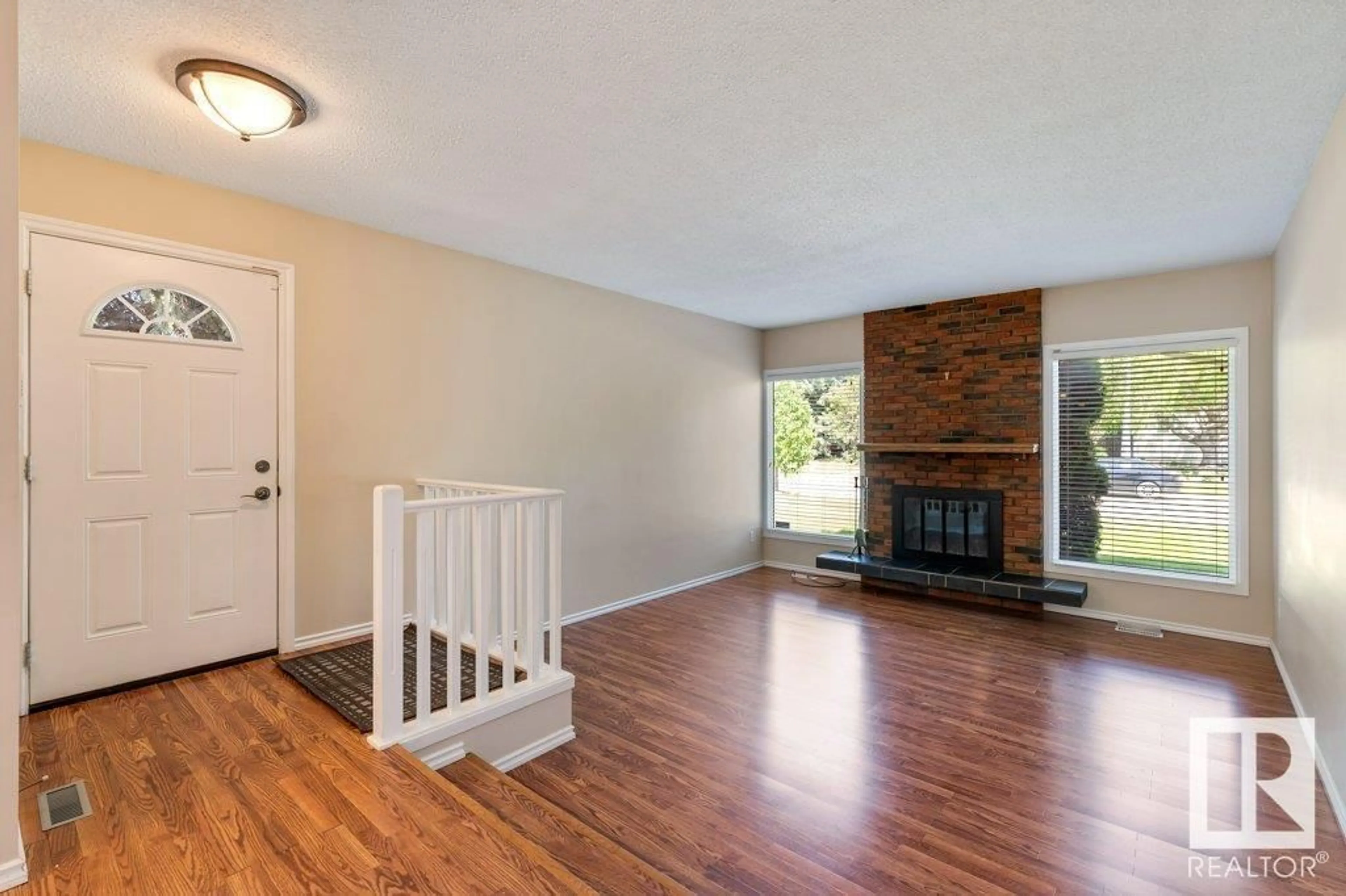 Living room with furniture, wood/laminate floor for 2 LINDBERGH CR, St. Albert Alberta T8N2S9