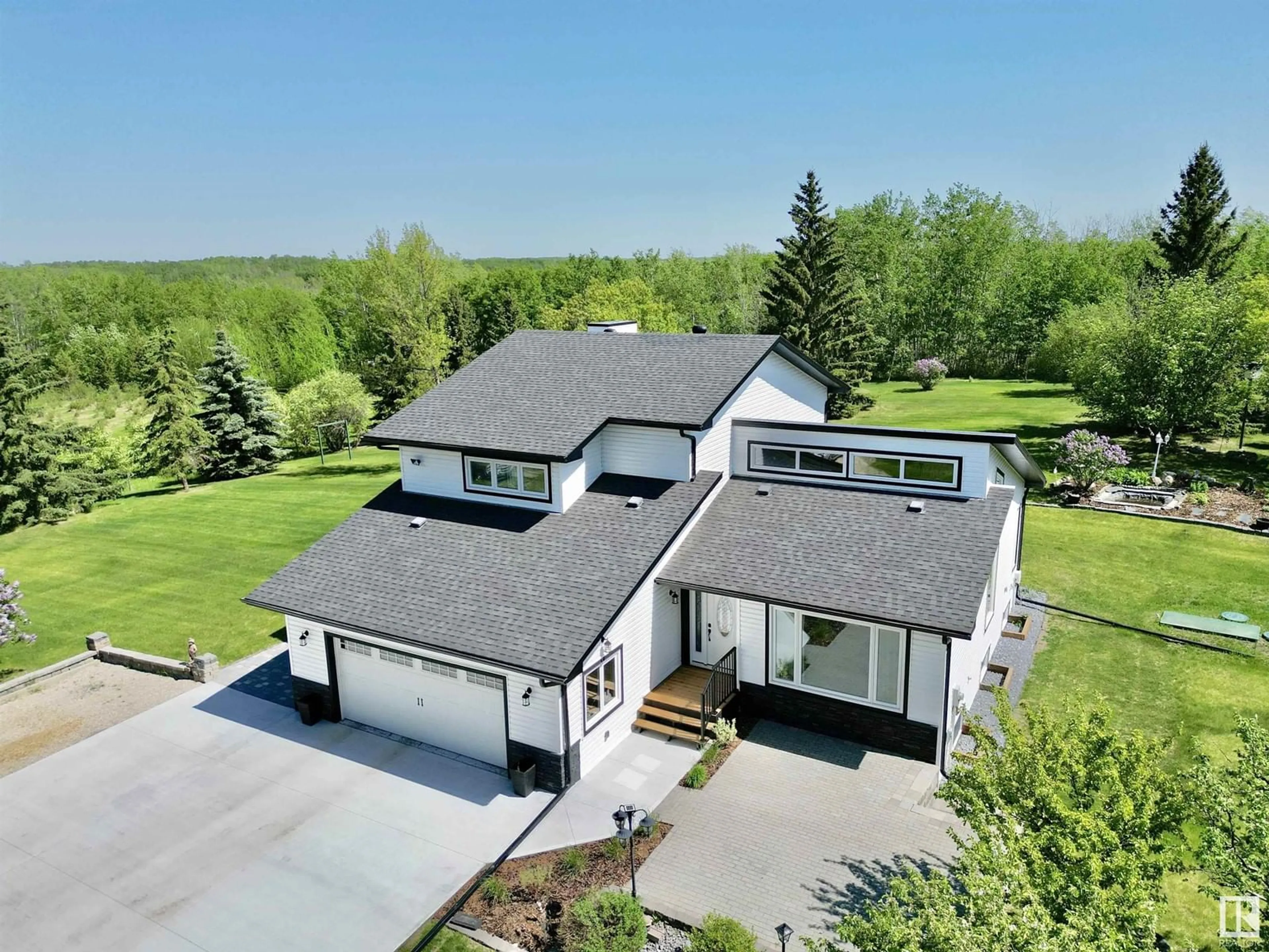A pic from outside/outdoor area/front of a property/back of a property/a pic from drone, unknown for 49 21410 TWP ROAD 524, Rural Strathcona County Alberta T0B0E0