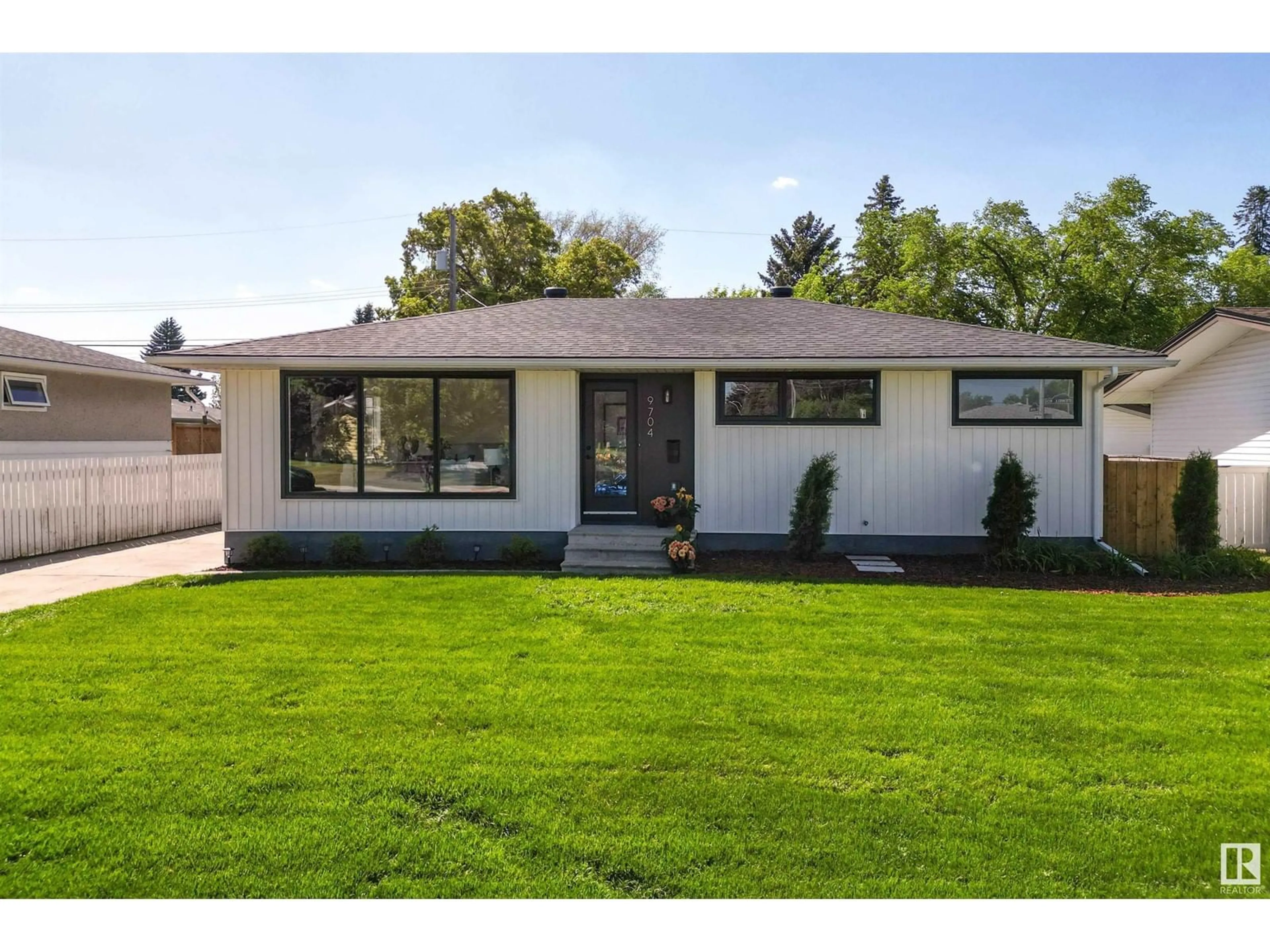 Home with vinyl exterior material, street for 9704 OTTEWELL RD, Edmonton Alberta T6B2E7