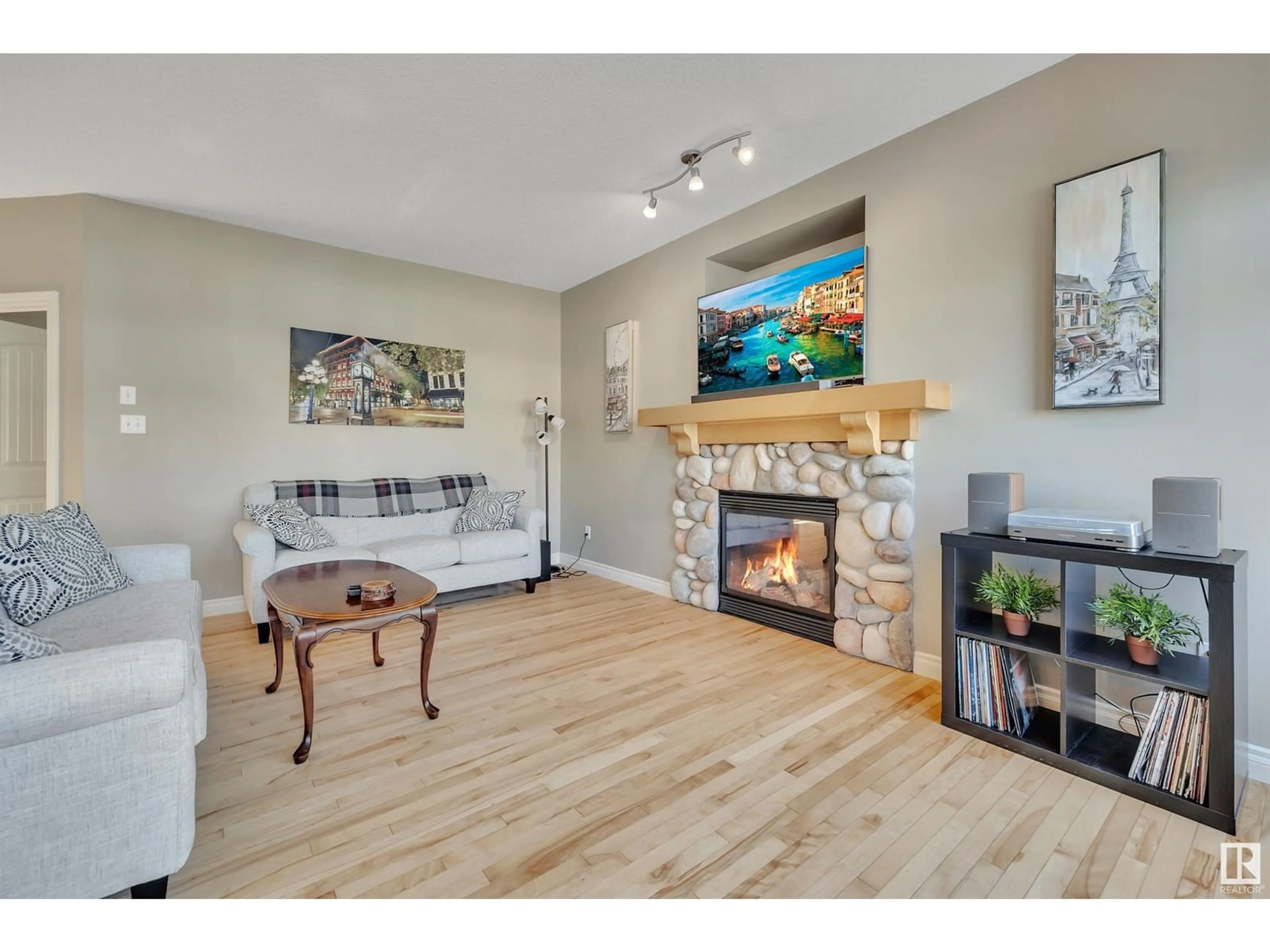 Living room with furniture, wood/laminate floor for 5416 THIBAULT WD, Edmonton Alberta T6R3J1