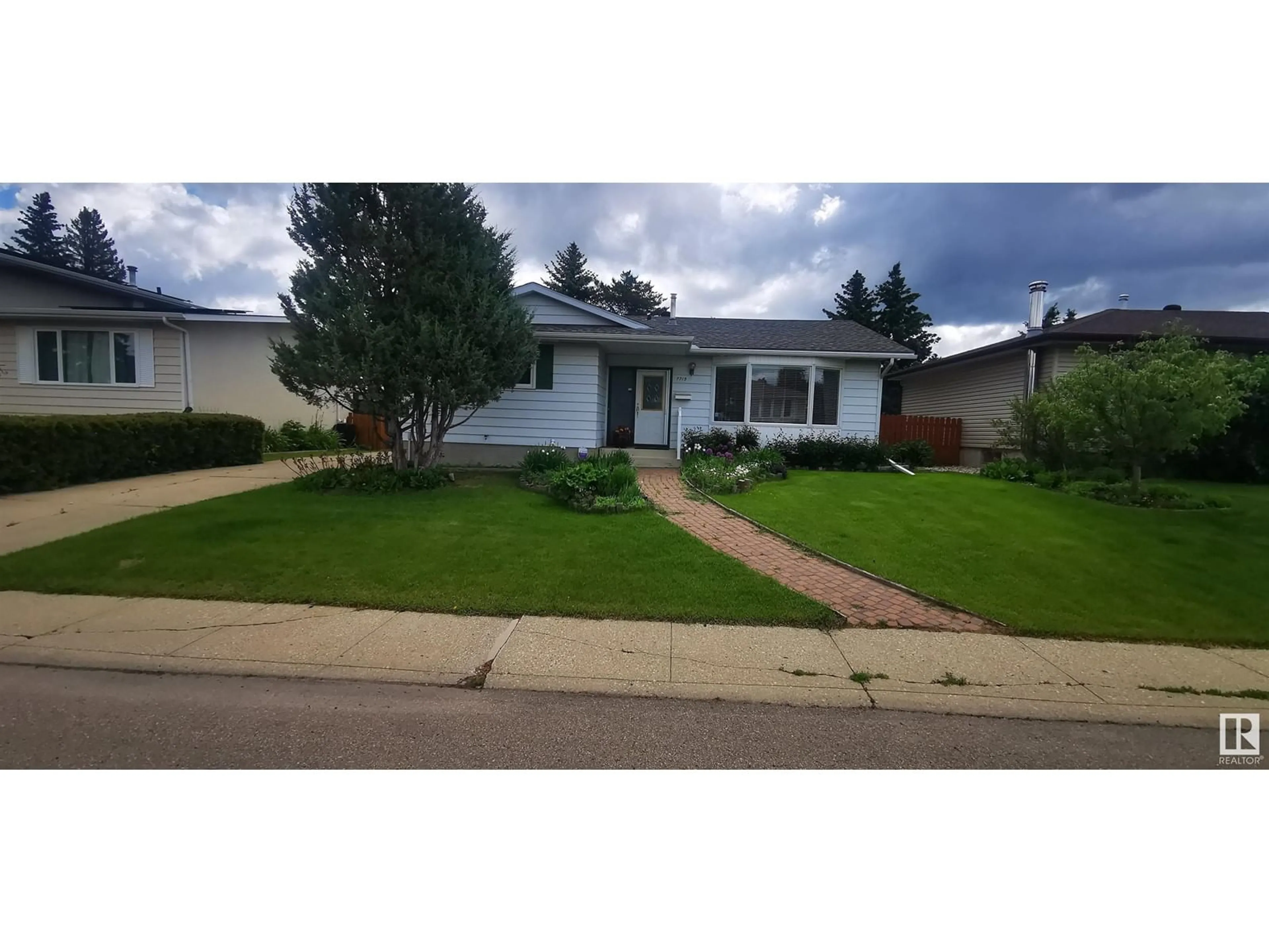 Home with vinyl exterior material, street for NW - 7715 173 ST, Edmonton Alberta T5T0E5