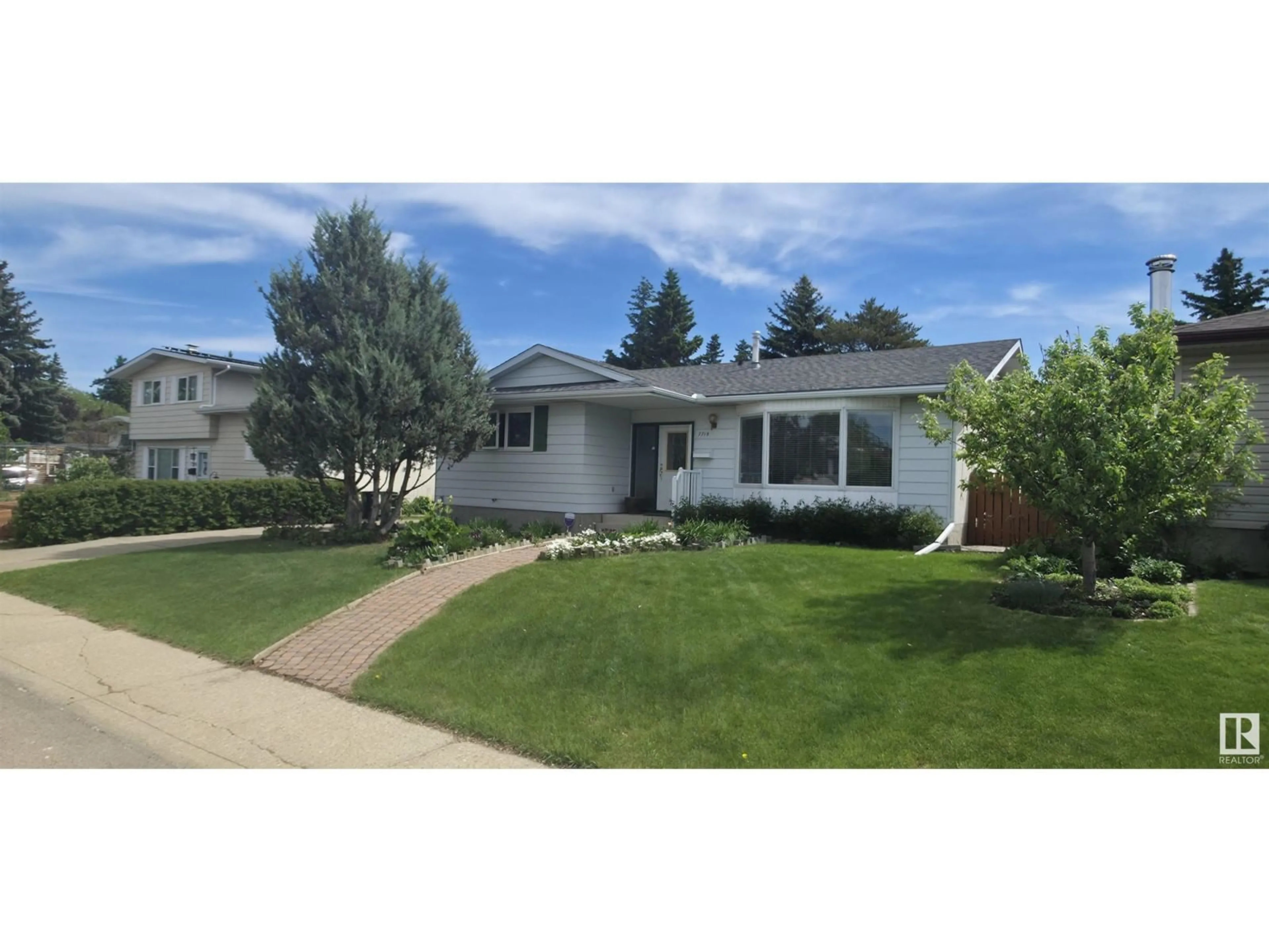Home with vinyl exterior material, street for NW - 7715 173 ST, Edmonton Alberta T5T0E5