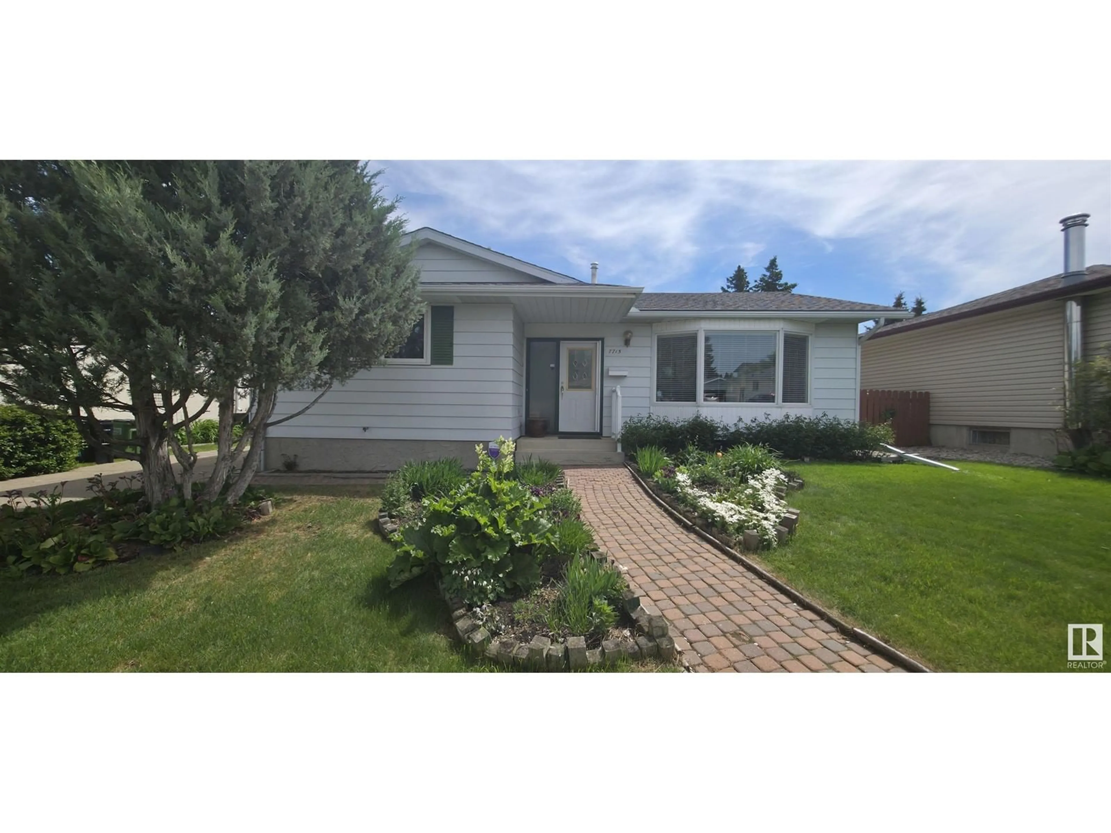 Home with vinyl exterior material, street for NW - 7715 173 ST, Edmonton Alberta T5T0E5