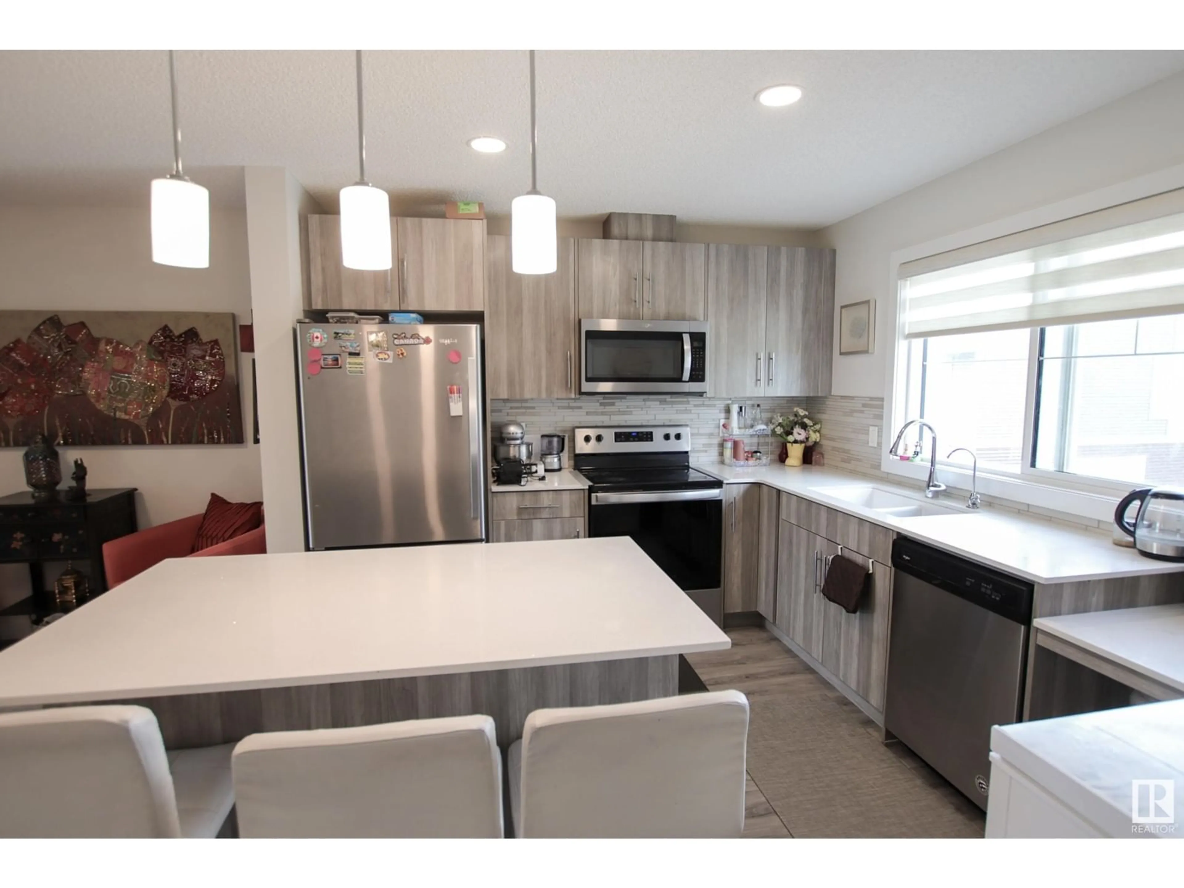 Open concept kitchen, ceramic/tile floor for 15 - 3025 151 AV, Edmonton Alberta T5Y3W4