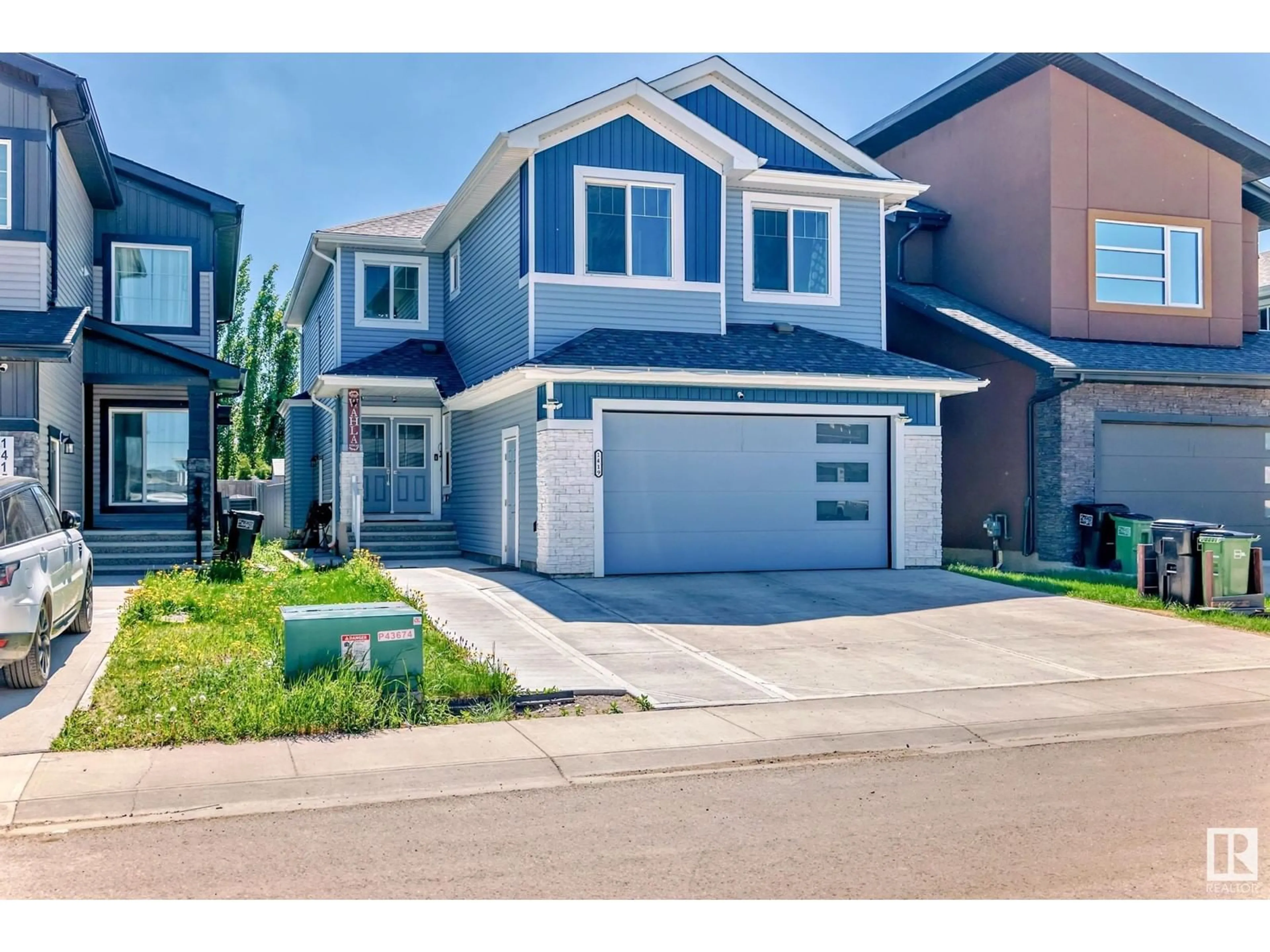 Home with vinyl exterior material, street for NW - 1419 150 AV, Edmonton Alberta T5Y3R5