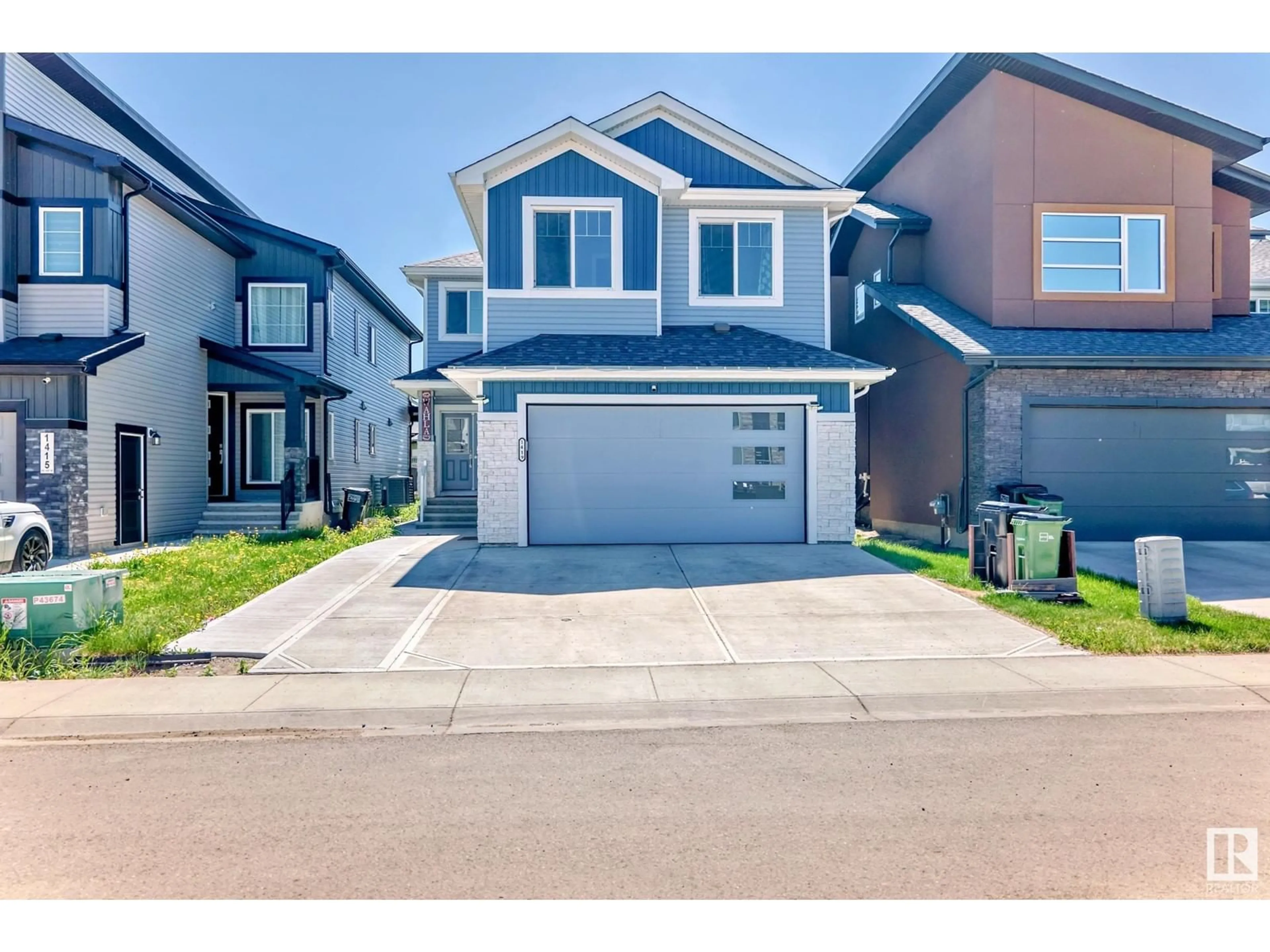 Home with vinyl exterior material, street for NW - 1419 150 AV, Edmonton Alberta T5Y3R5