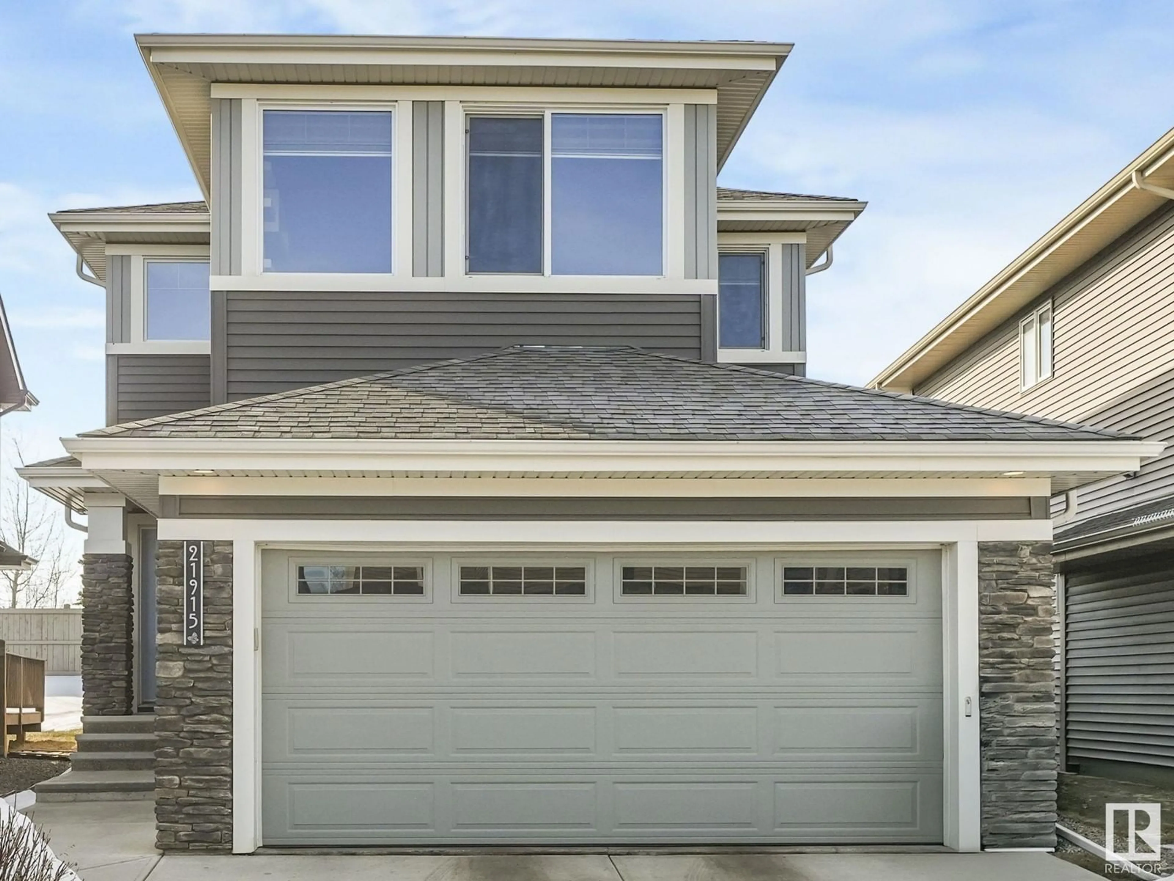 Home with vinyl exterior material, street for 21915 80 AV, Edmonton Alberta T5T4S2