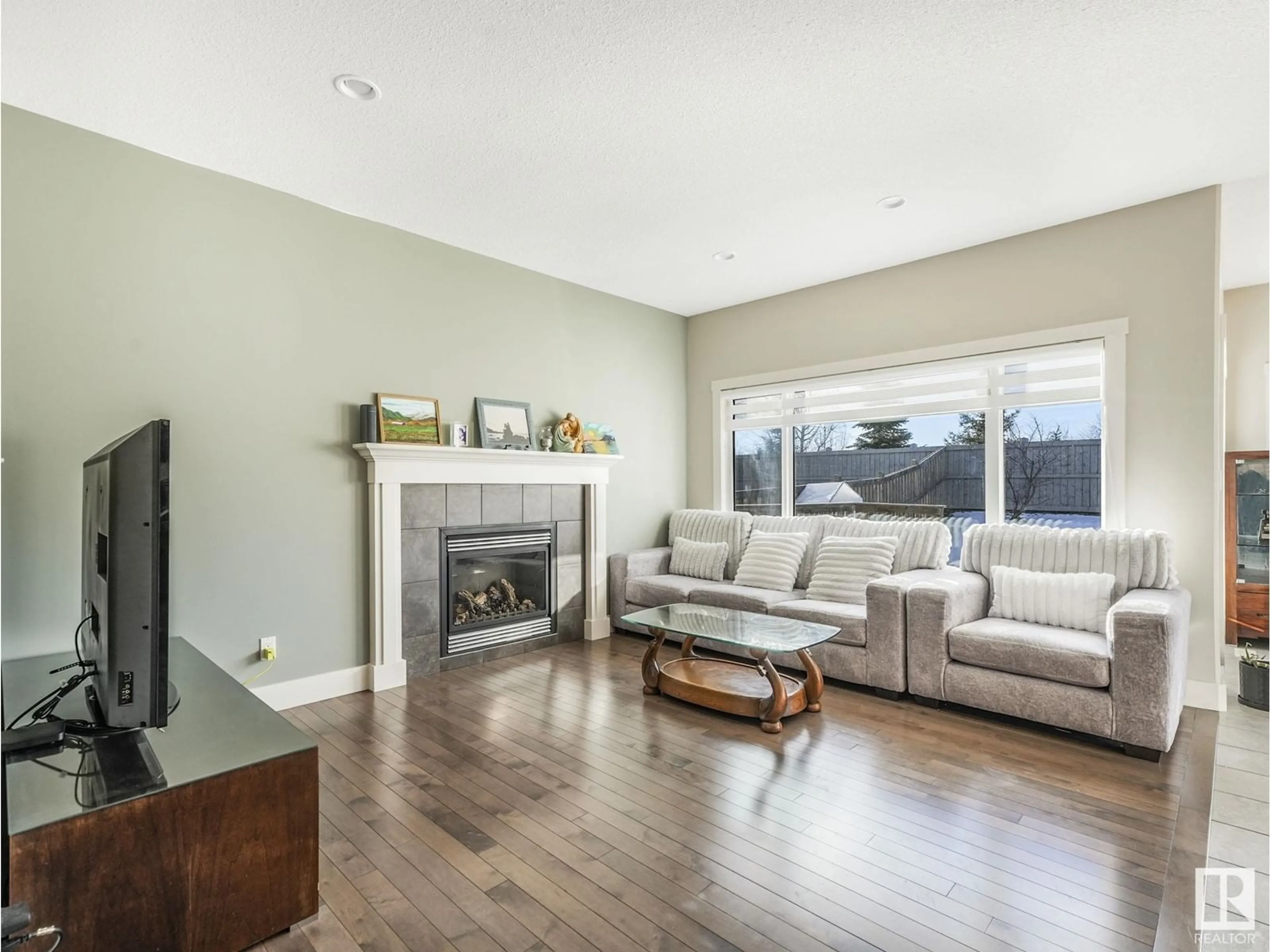 Living room with furniture, wood/laminate floor for 21915 80 AV, Edmonton Alberta T5T4S2
