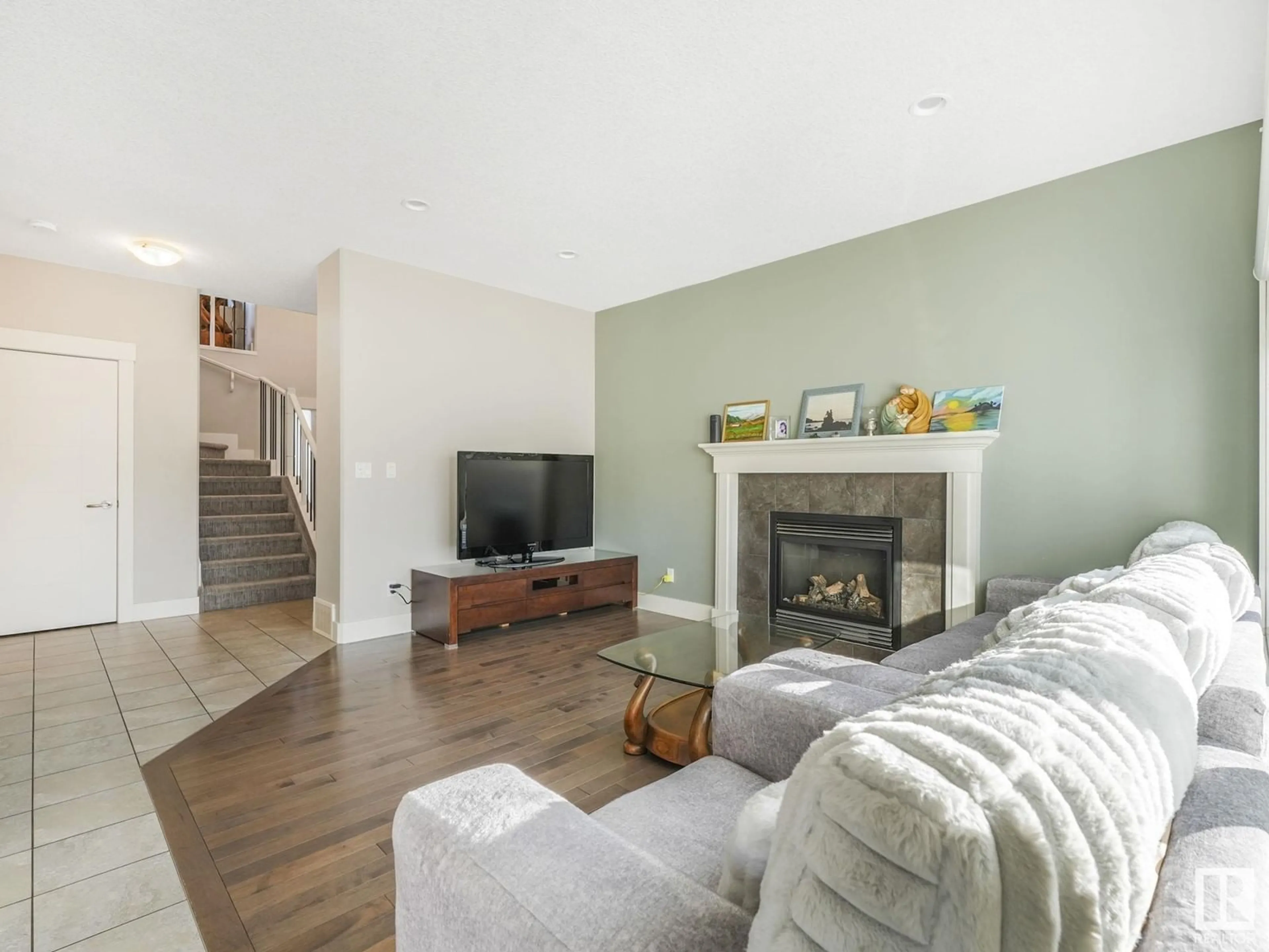 Living room with furniture, wood/laminate floor for 21915 80 AV, Edmonton Alberta T5T4S2