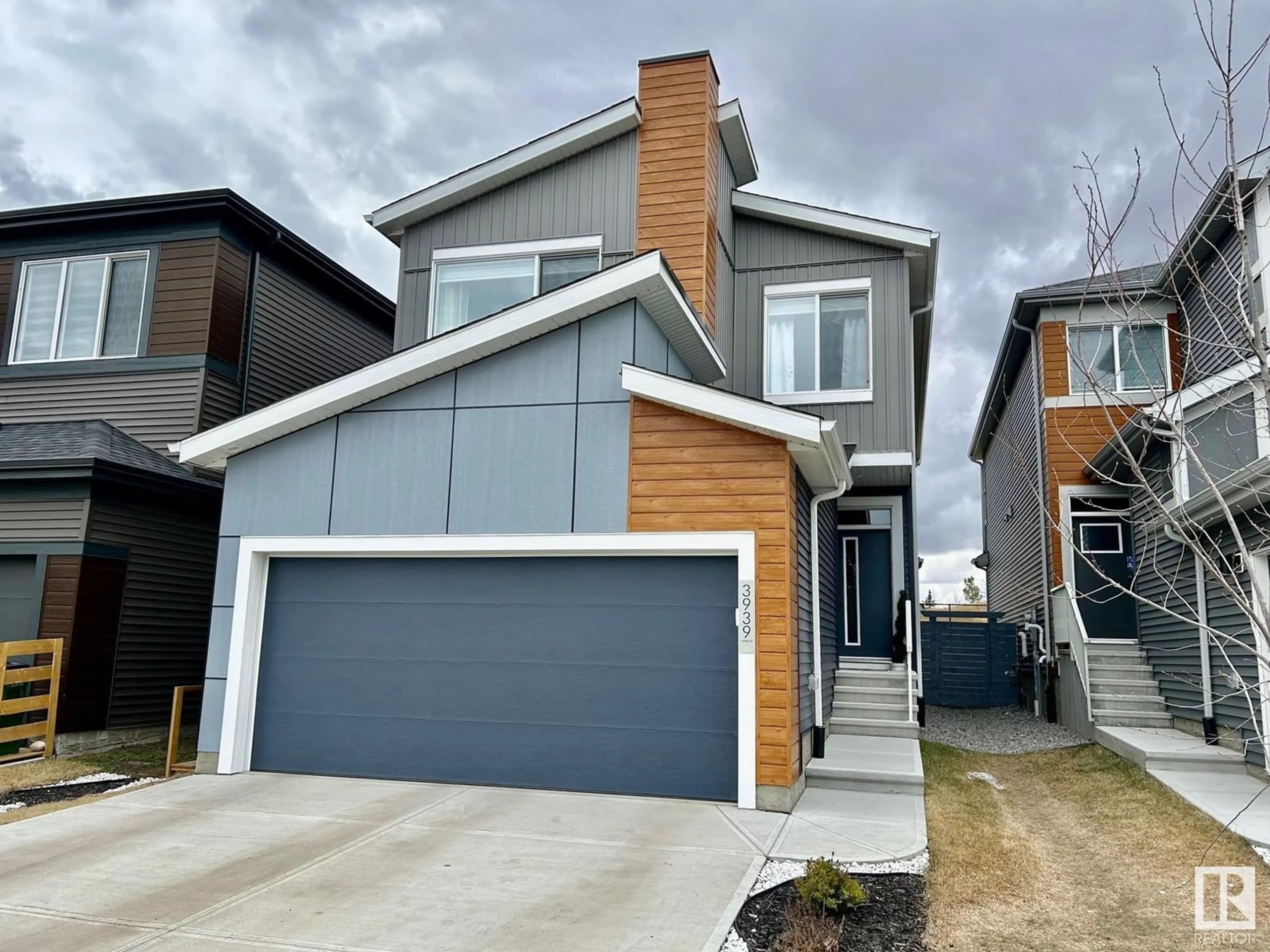Home with vinyl exterior material, street for 3939 5 AV, Edmonton Alberta T6X2X8