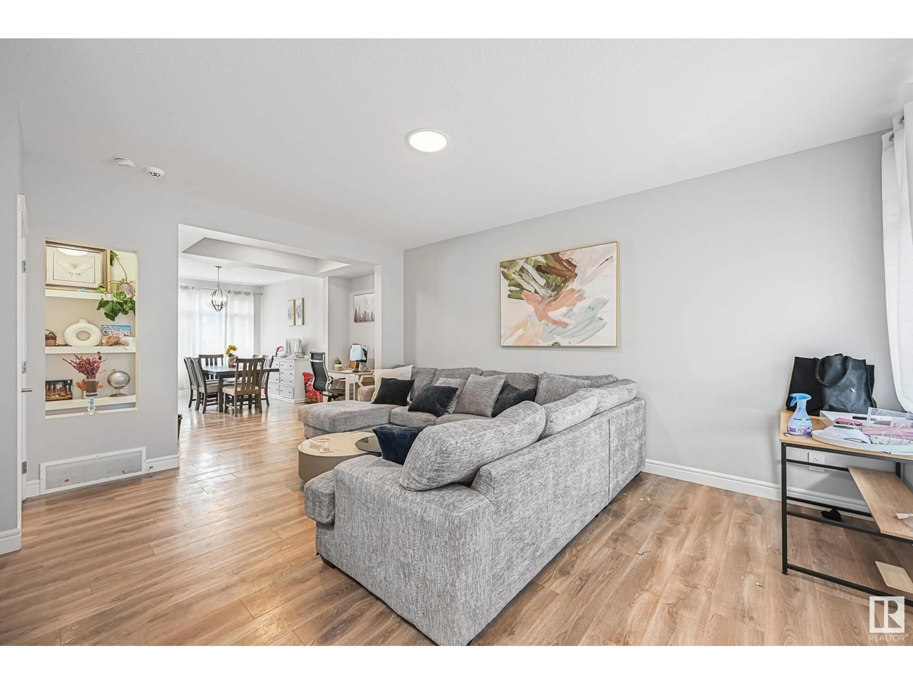 Living room with furniture, wood/laminate floor for 16703 30 AV, Edmonton Alberta T6W4P9