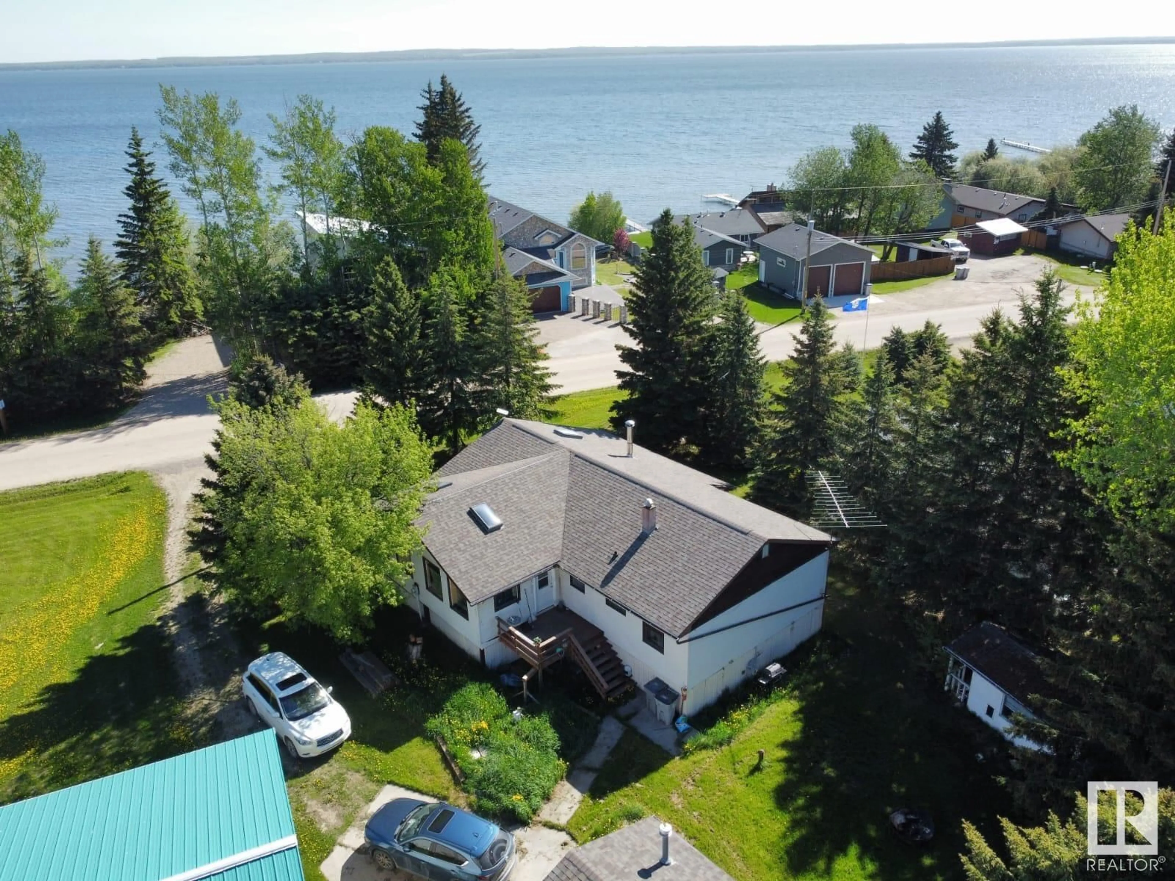 A pic from outside/outdoor area/front of a property/back of a property/a pic from drone, water/lake/river/ocean view for 26 LAKESHORE DR, Rural Wetaskiwin County Alberta T0C2V0