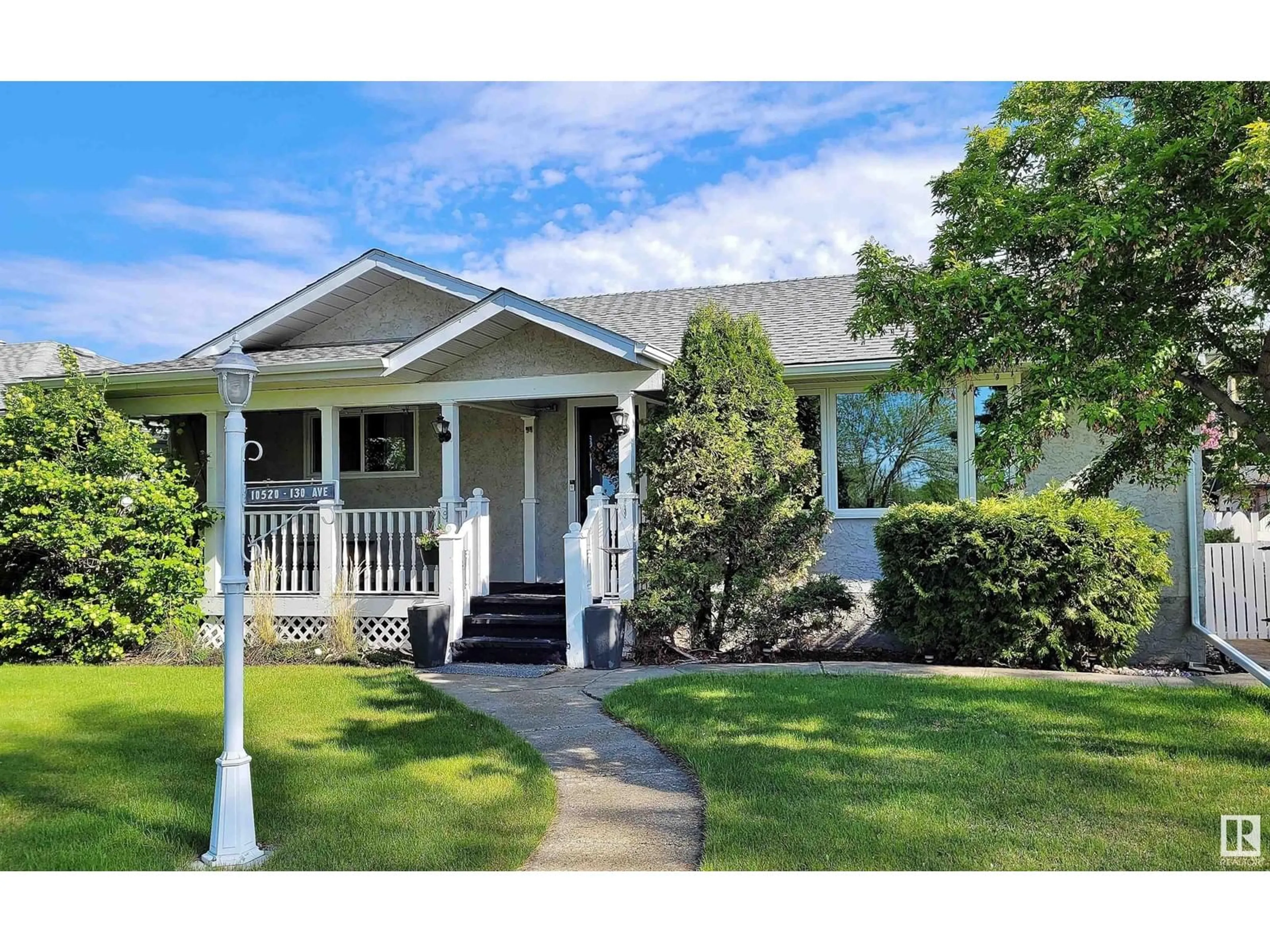 Home with vinyl exterior material, street for 10520 130 AV, Edmonton Alberta T5E0S8