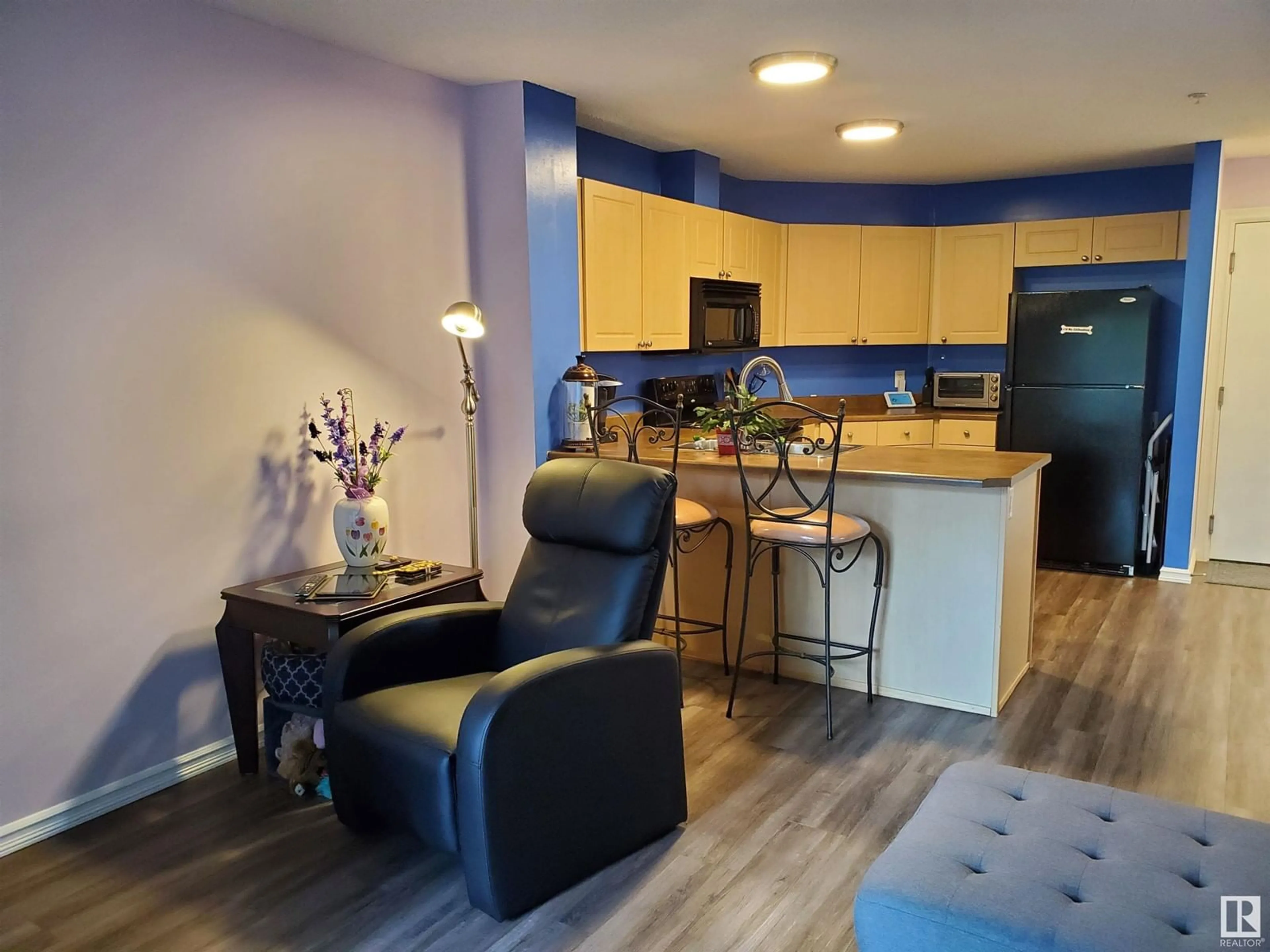 Open concept kitchen, wood/laminate floor for #109 - 4403 23 ST, Edmonton Alberta T6T1E4