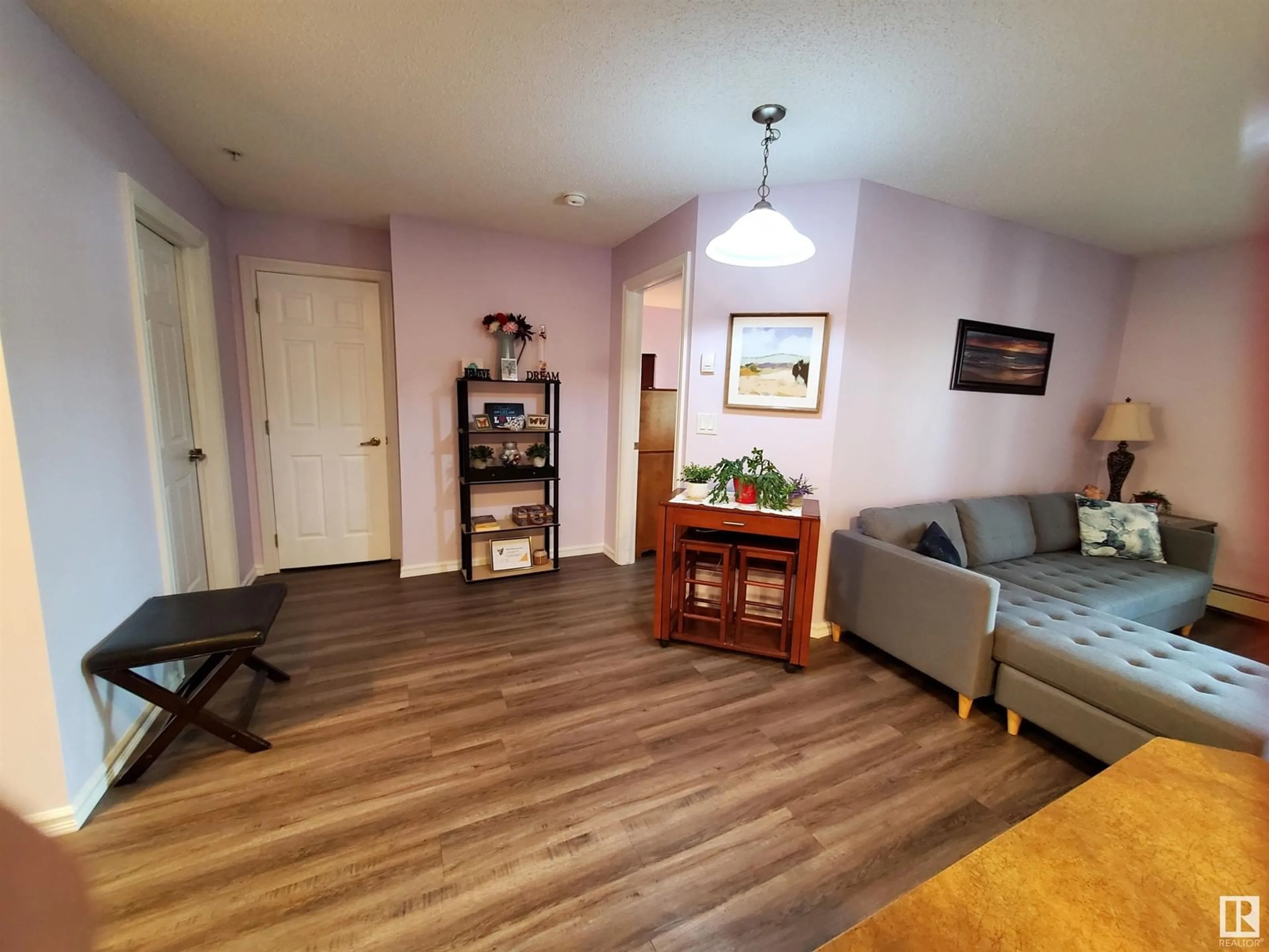 Living room with furniture, wood/laminate floor for #109 - 4403 23 ST, Edmonton Alberta T6T1E4