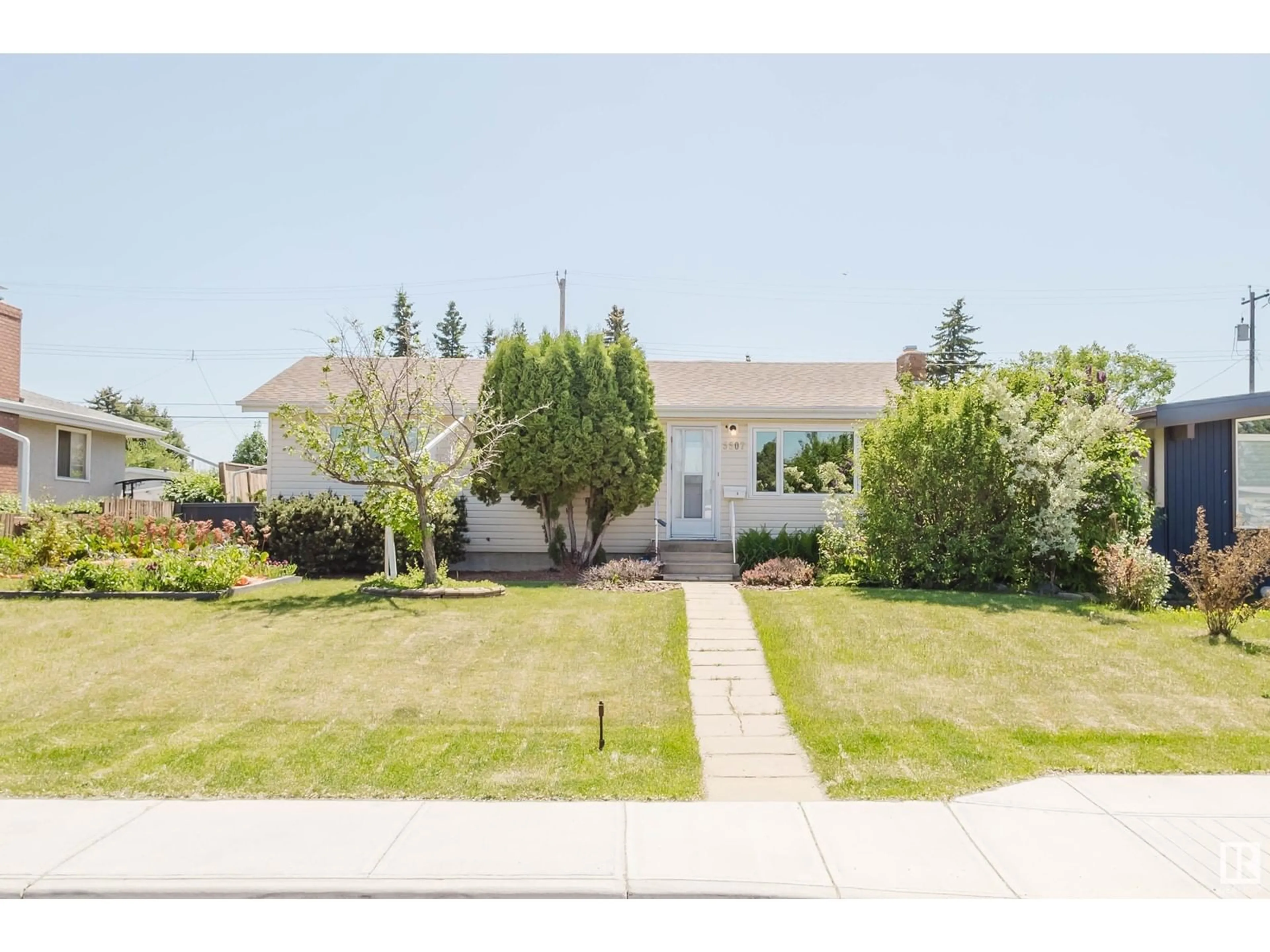 Home with vinyl exterior material, street for NW - 5507 92A AV, Edmonton Alberta T6B0S9