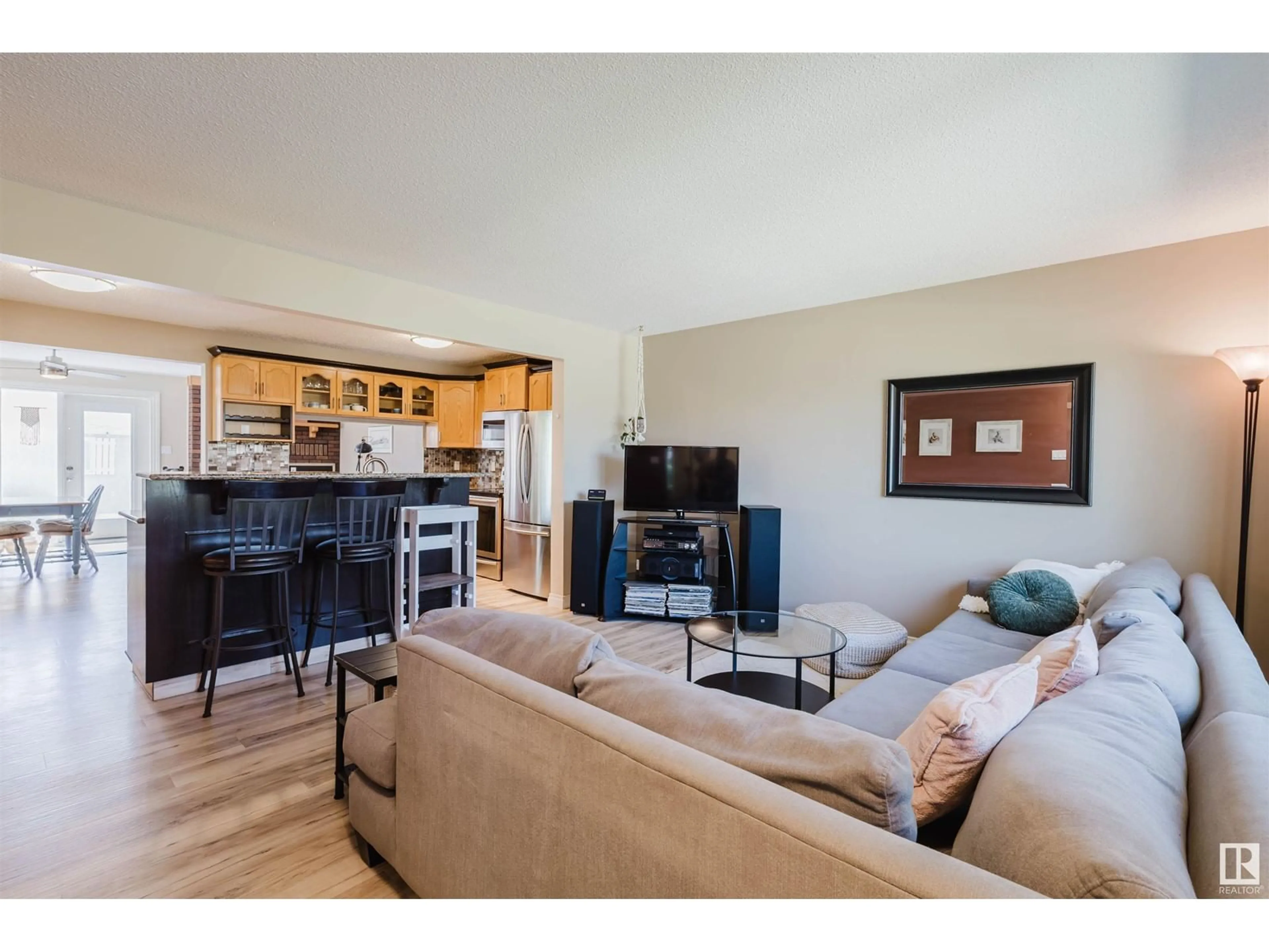 Living room with furniture, wood/laminate floor for NW - 5507 92A AV, Edmonton Alberta T6B0S9