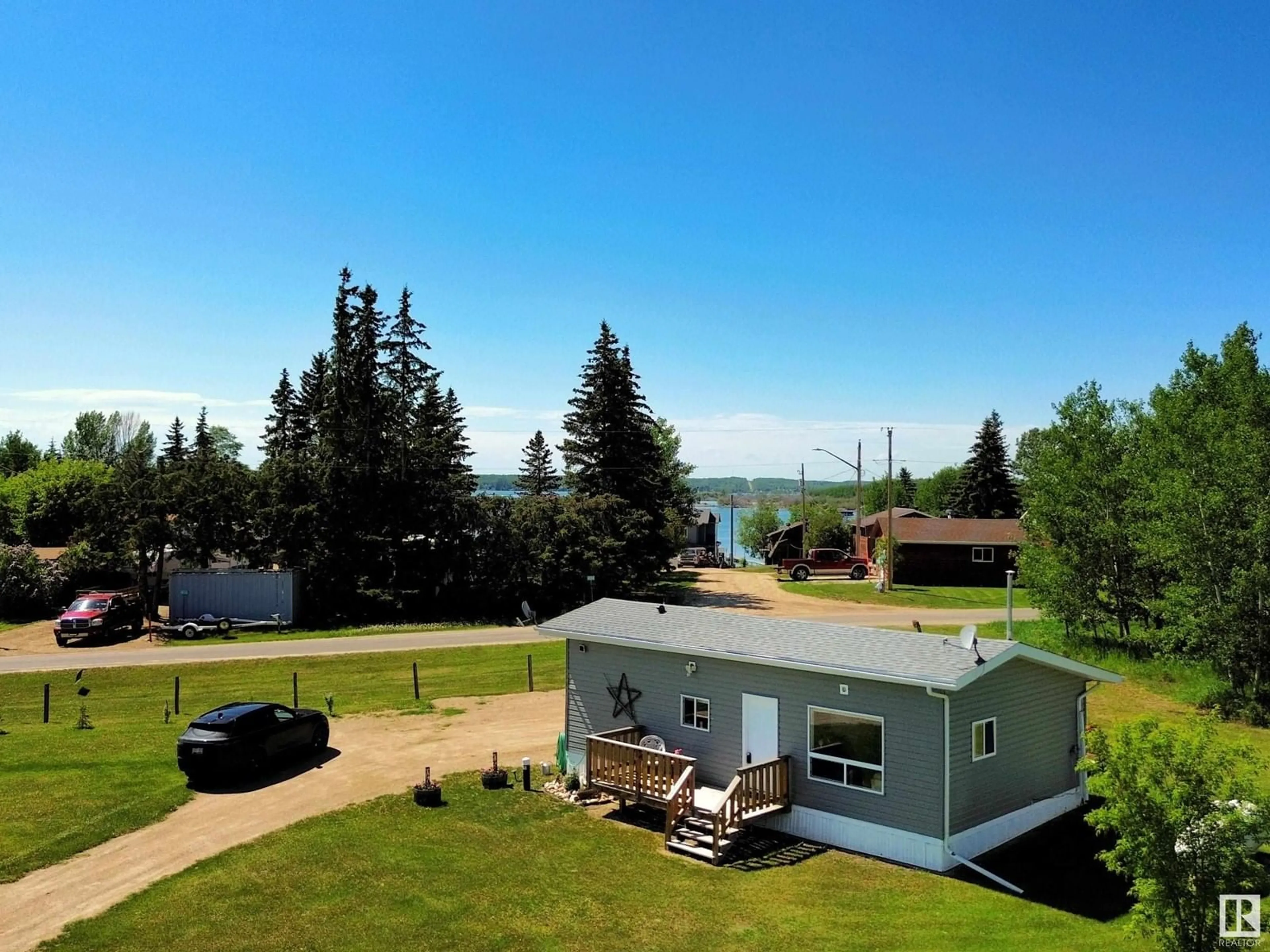 A pic from outside/outdoor area/front of a property/back of a property/a pic from drone, water/lake/river/ocean view for 106 - 57730 RANGE ROAD 30, Rural Barrhead County Alberta T0G0H0