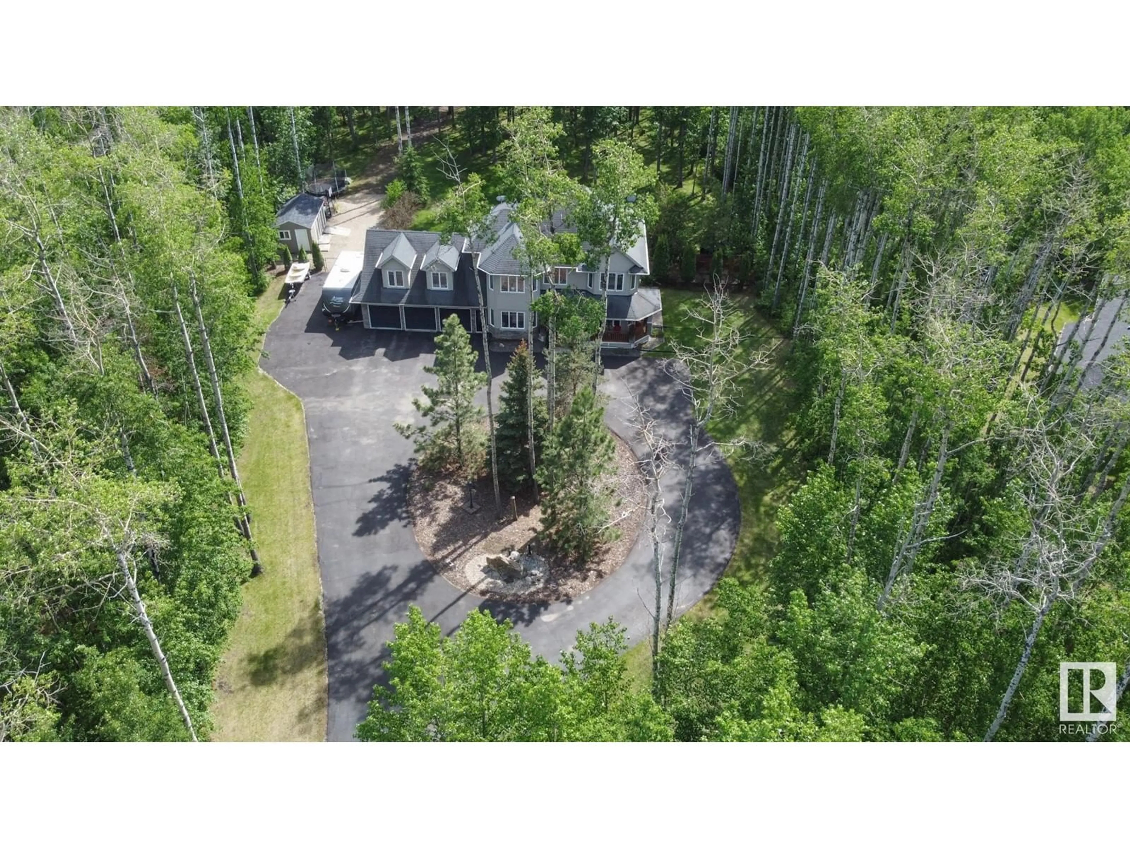A pic from outside/outdoor area/front of a property/back of a property/a pic from drone, forest/trees view for 53522 - 23 RGE ROAD 272, Rural Parkland County Alberta T7X3N2