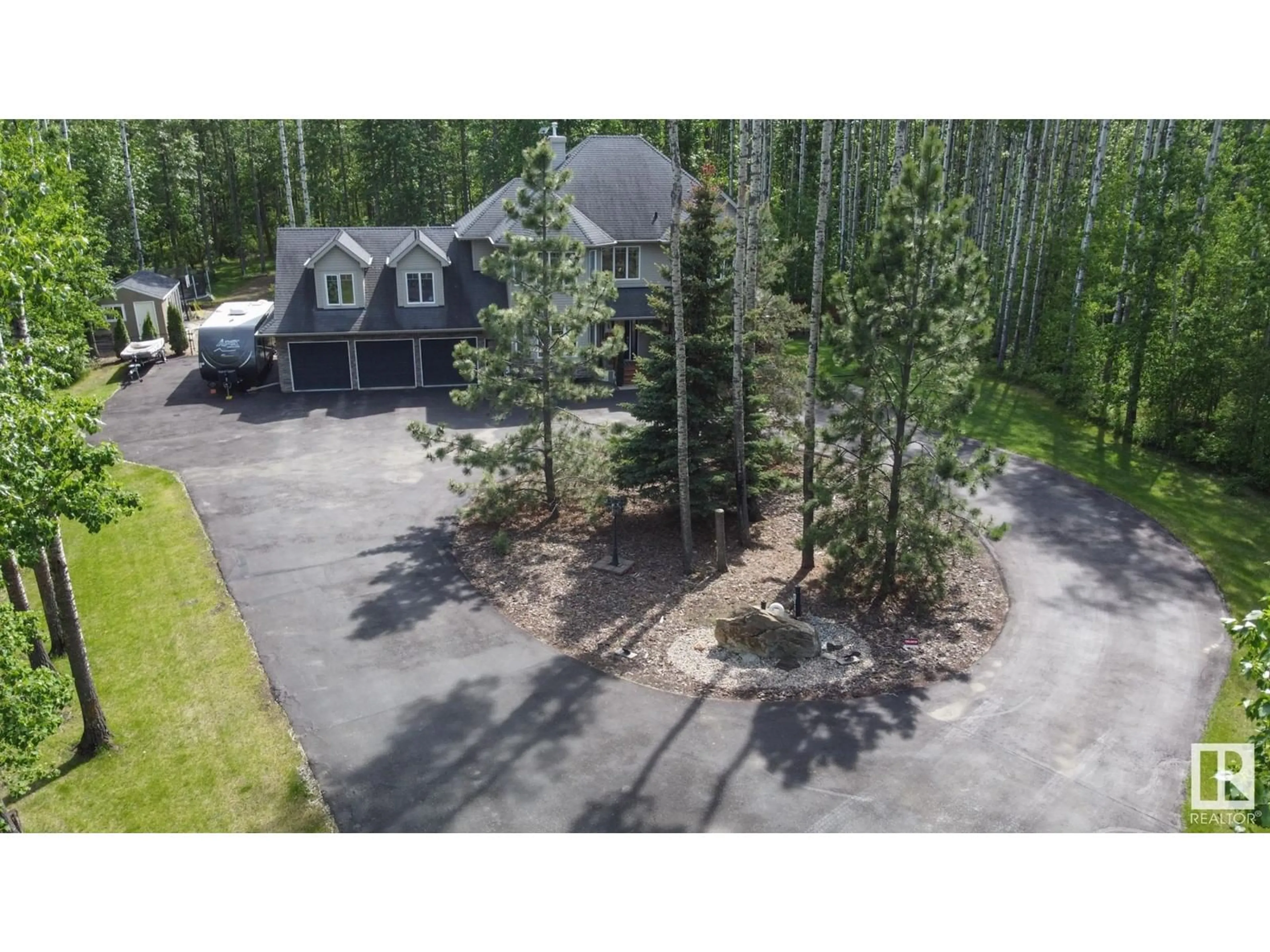 A pic from outside/outdoor area/front of a property/back of a property/a pic from drone, forest/trees view for 53522 - 23 RGE ROAD 272, Rural Parkland County Alberta T7X3N2