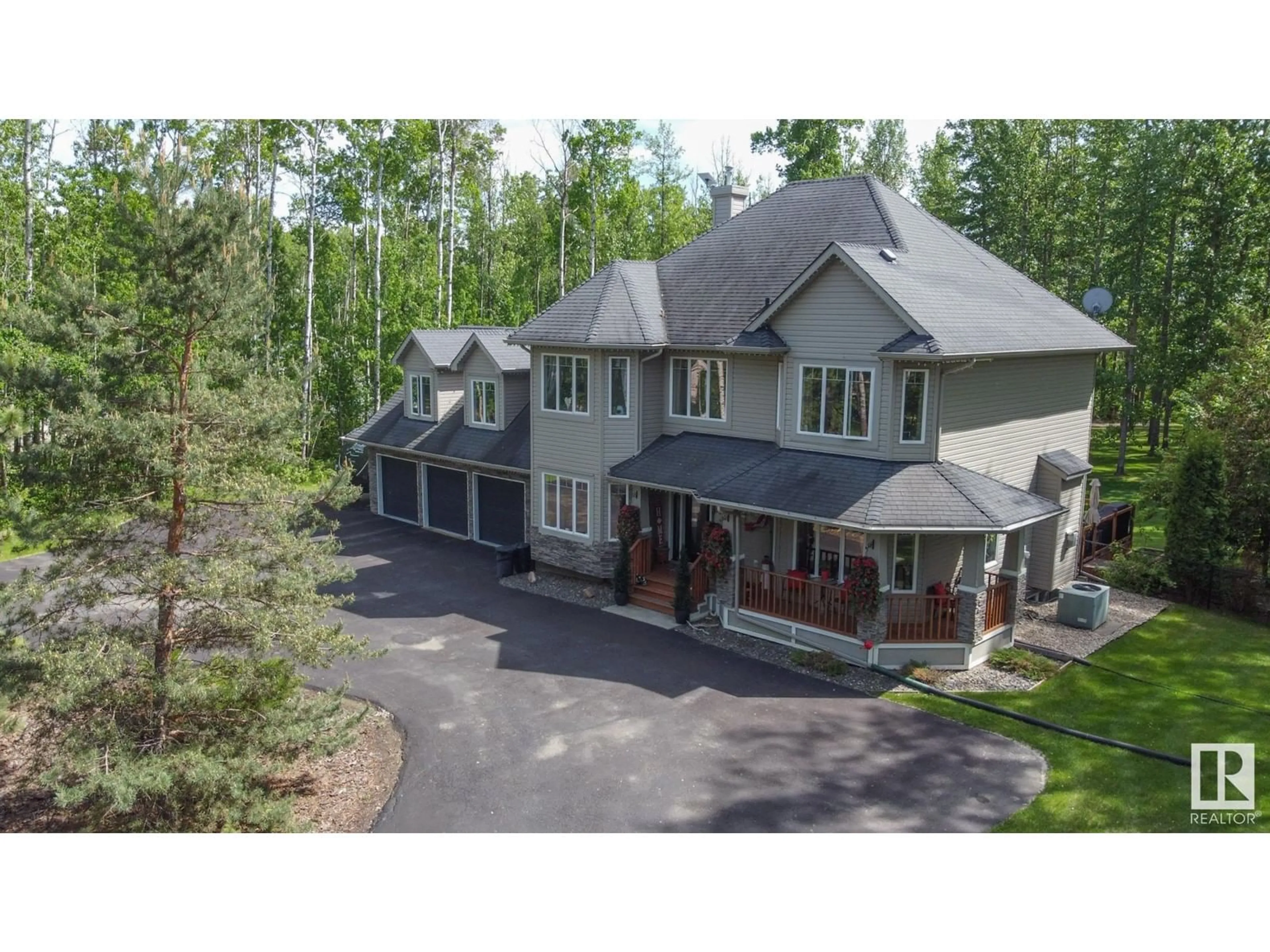 A pic from outside/outdoor area/front of a property/back of a property/a pic from drone, mountain view for 53522 - 23 RGE ROAD 272, Rural Parkland County Alberta T7X3N2