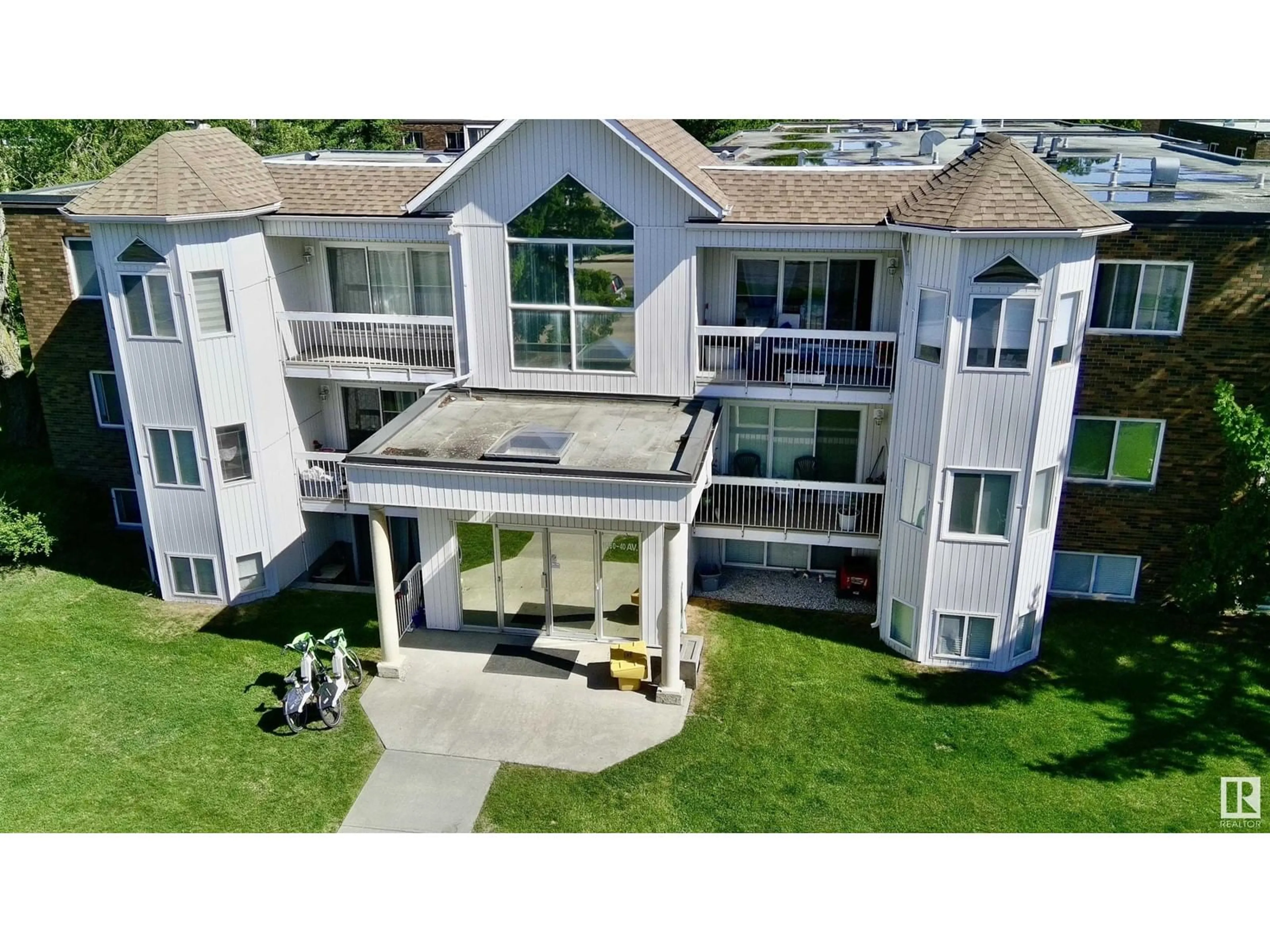 A pic from outside/outdoor area/front of a property/back of a property/a pic from drone, building for #103 - 11460 40 AV NW, Edmonton Alberta T6J0R5