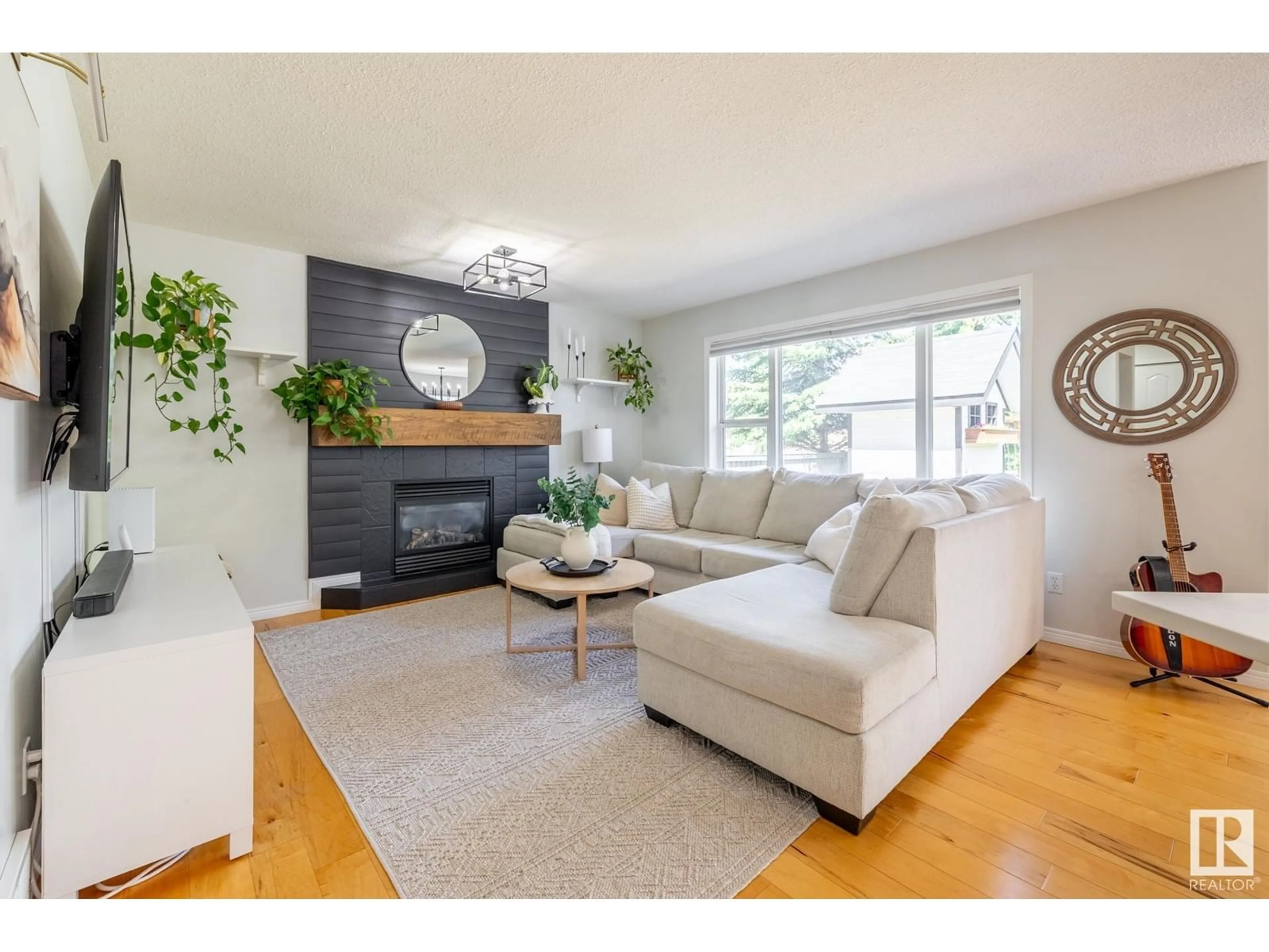 Living room with furniture, wood/laminate floor for 98 BONIN CR, Beaumont Alberta T4X1N7