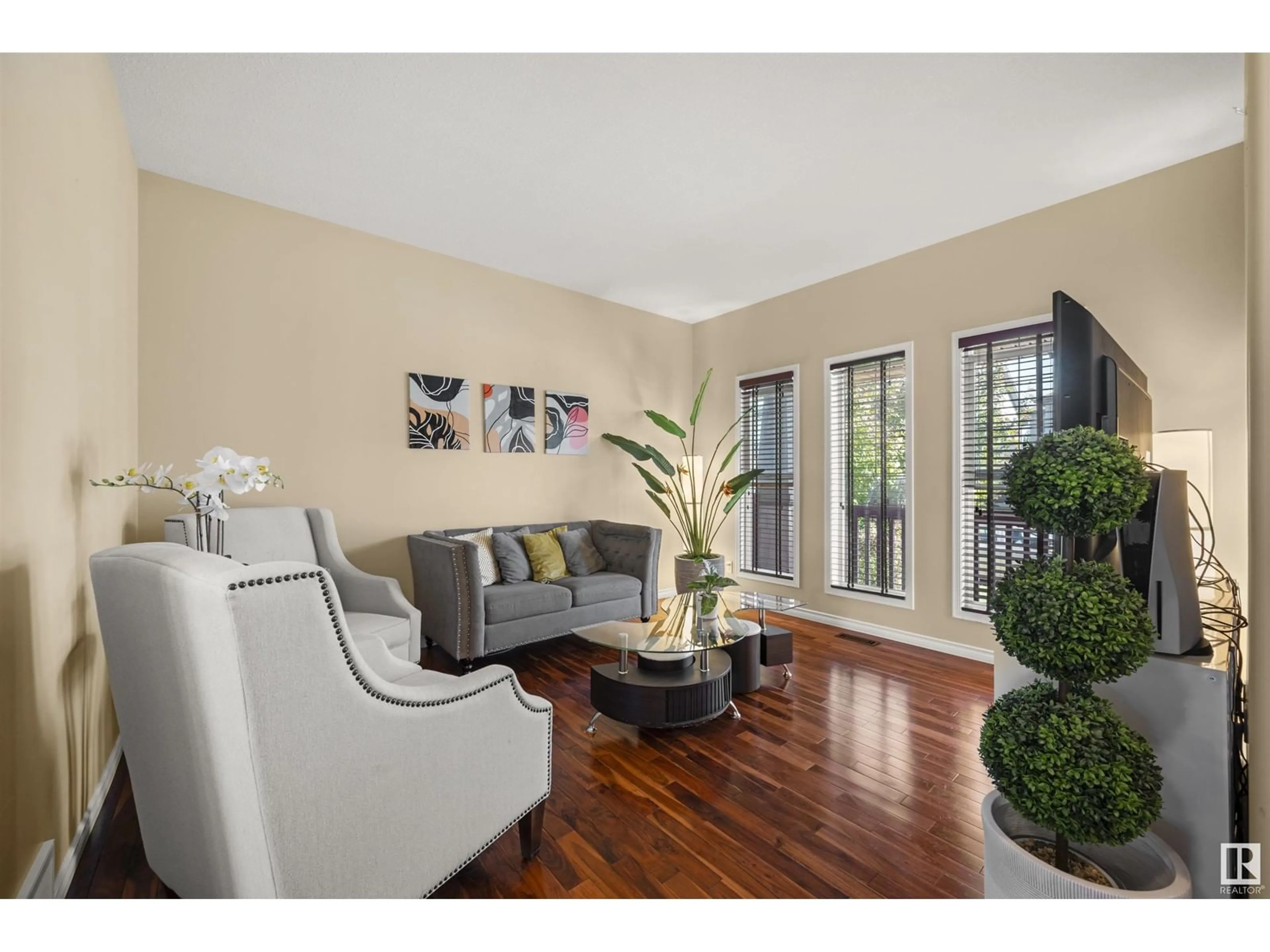 Living room with furniture, wood/laminate floor for 21232 58 AV, Edmonton Alberta T6M0H4