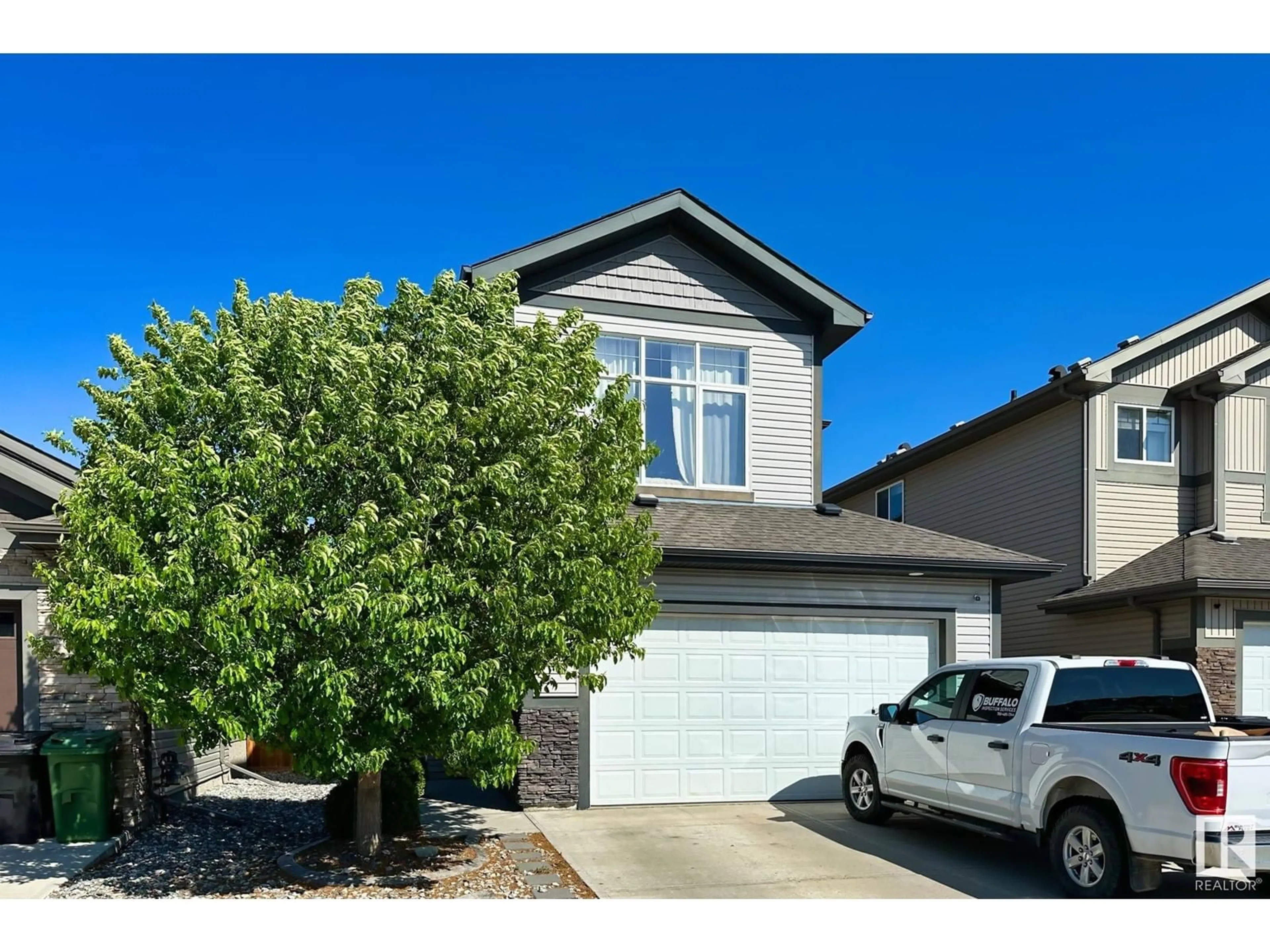 Home with vinyl exterior material, street for 138 WOODHILL LN, Fort Saskatchewan Alberta T8L0L8