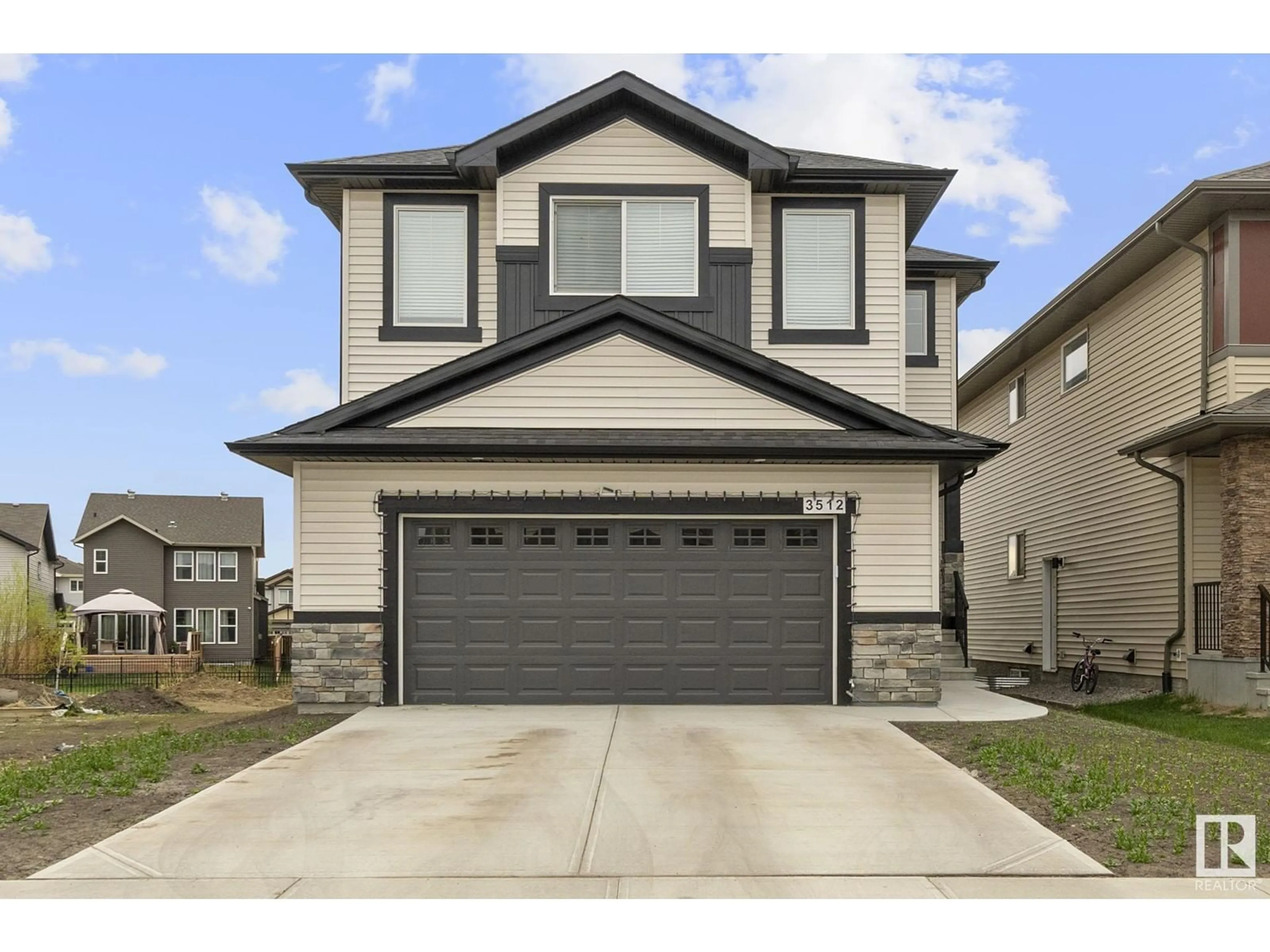Home with vinyl exterior material, street for NW - 3512 6 ST, Edmonton Alberta T6T2L5