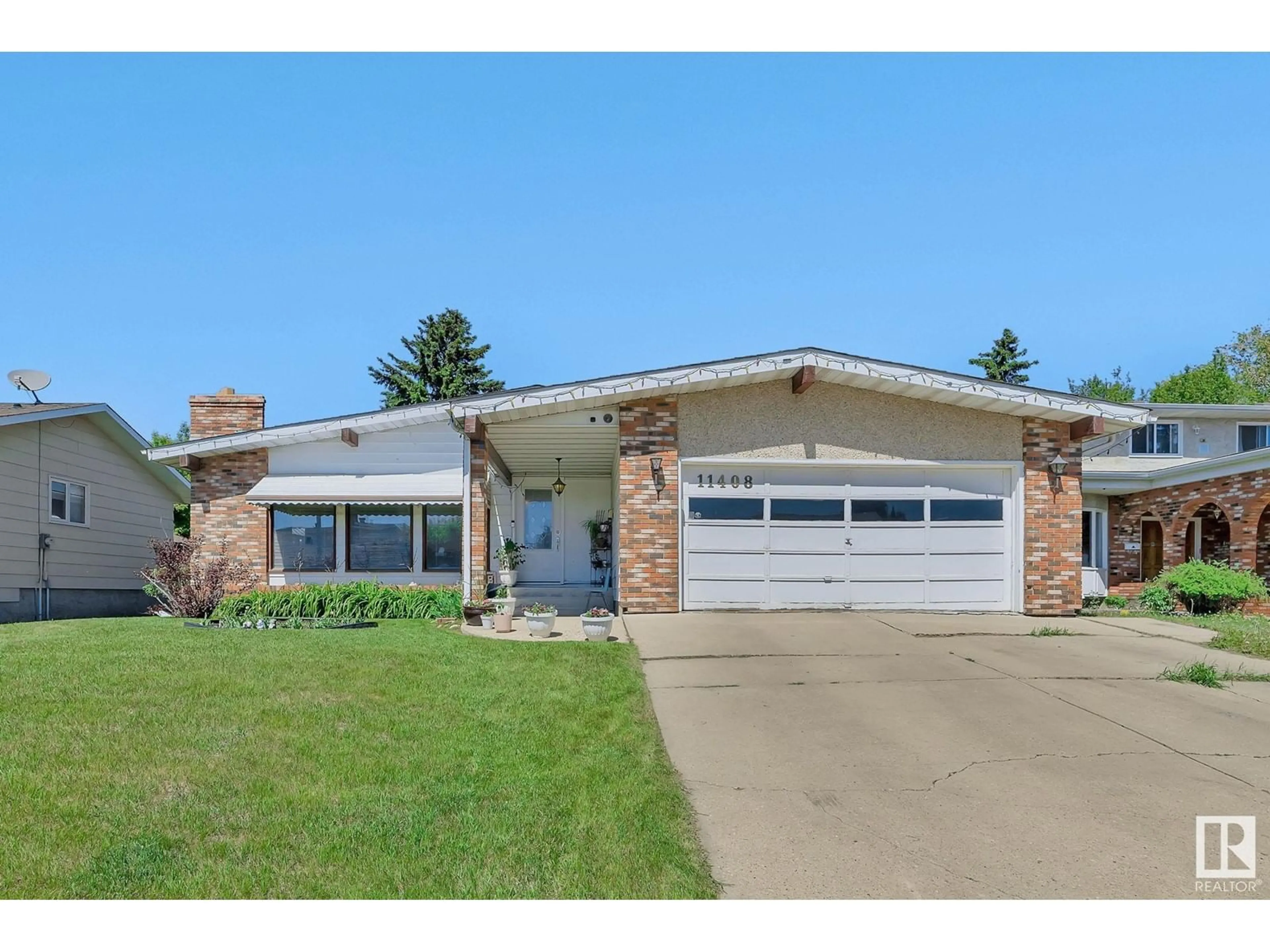 Home with brick exterior material, street for 11408 159 AV, Edmonton Alberta T5X2K6
