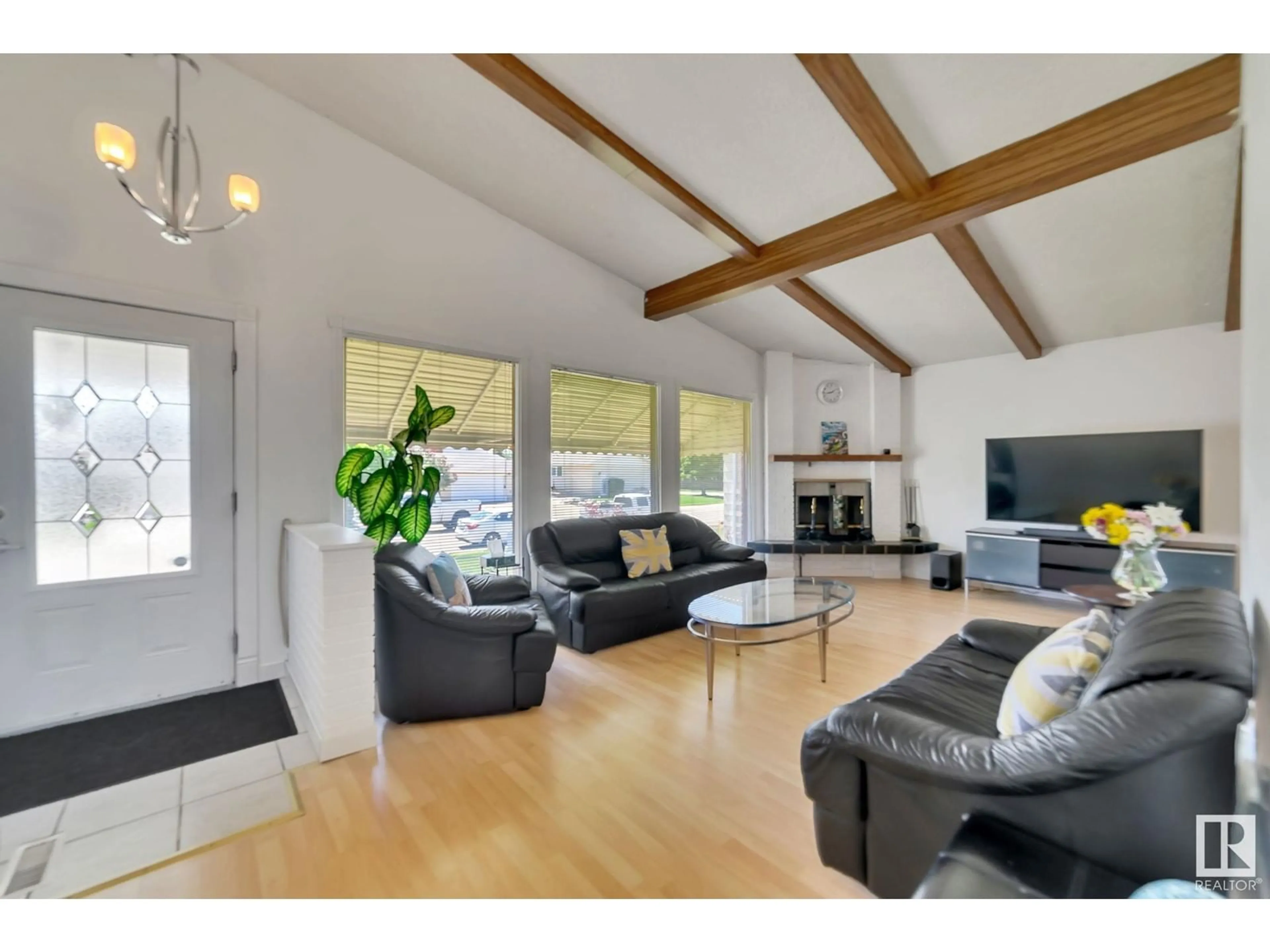 Living room with furniture, wood/laminate floor for 11408 159 AV, Edmonton Alberta T5X2K6