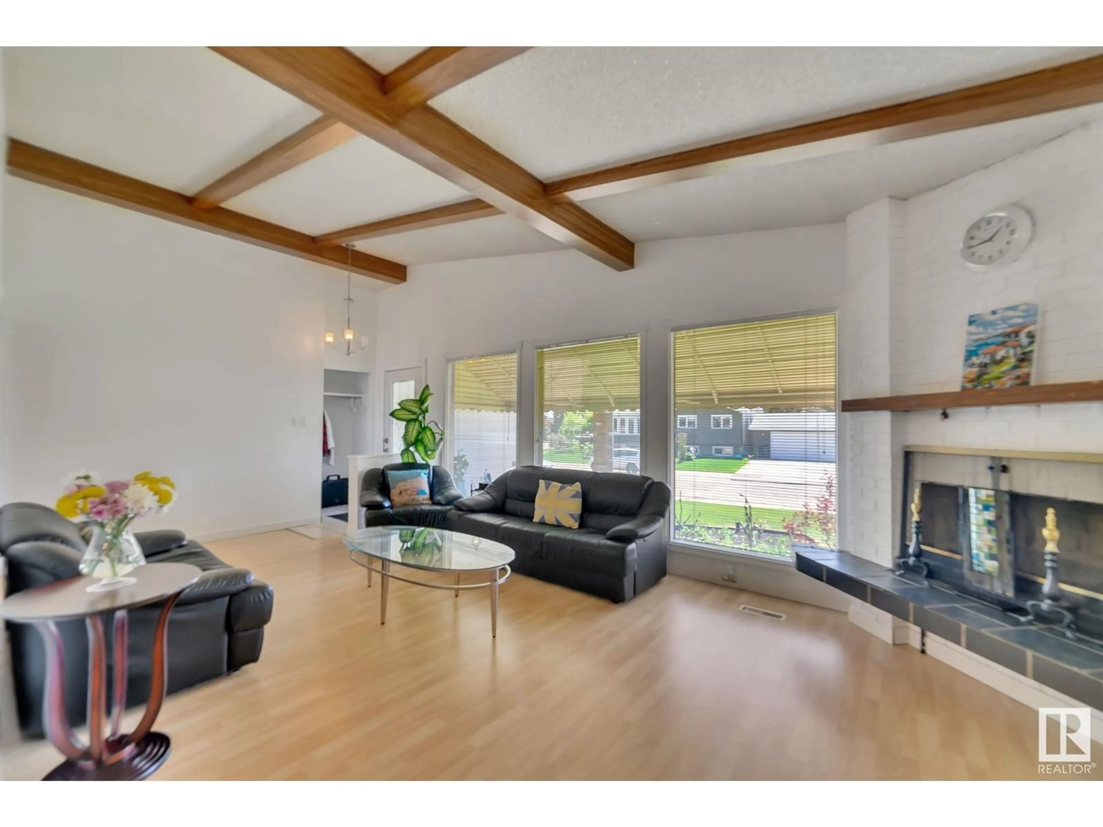 Living room with furniture, wood/laminate floor for 11408 159 AV, Edmonton Alberta T5X2K6