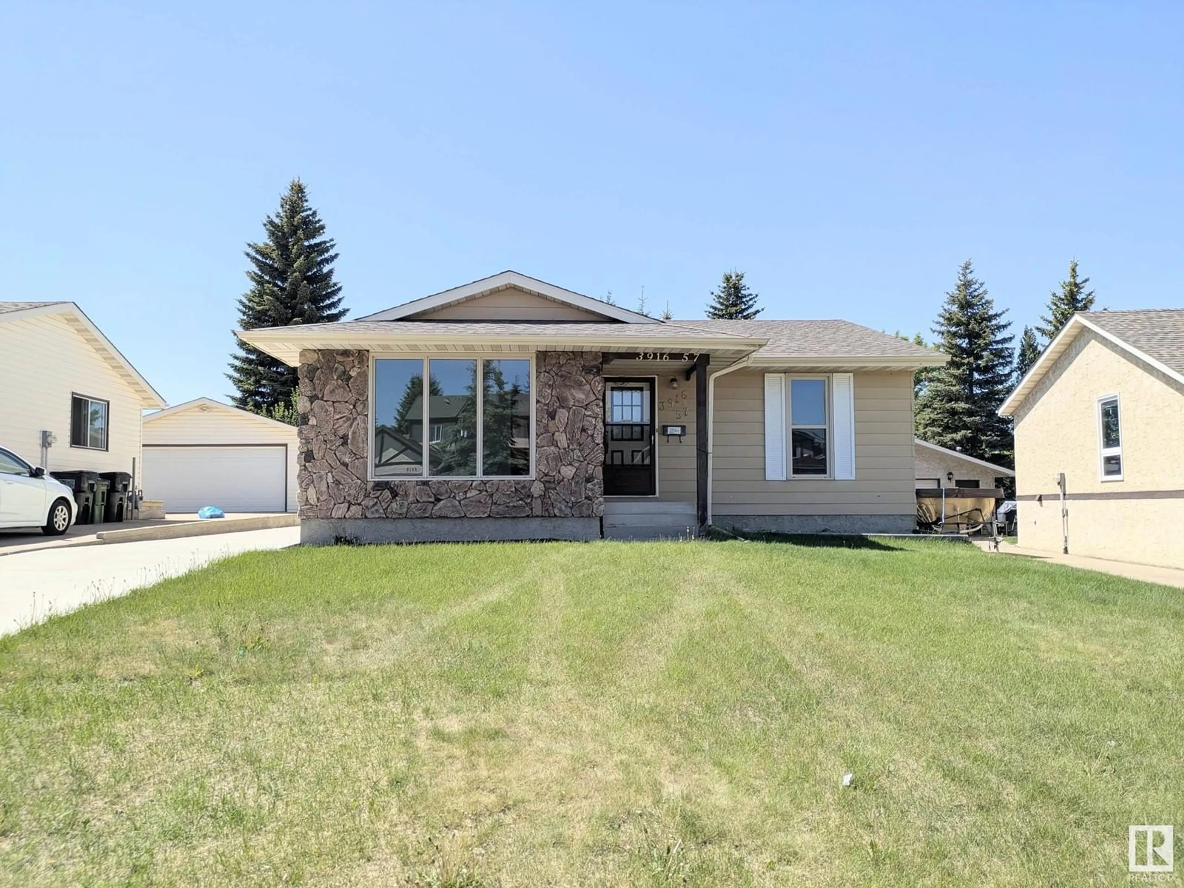 Home with vinyl exterior material, street for 3916 57 ST, Edmonton Alberta T6L1B6