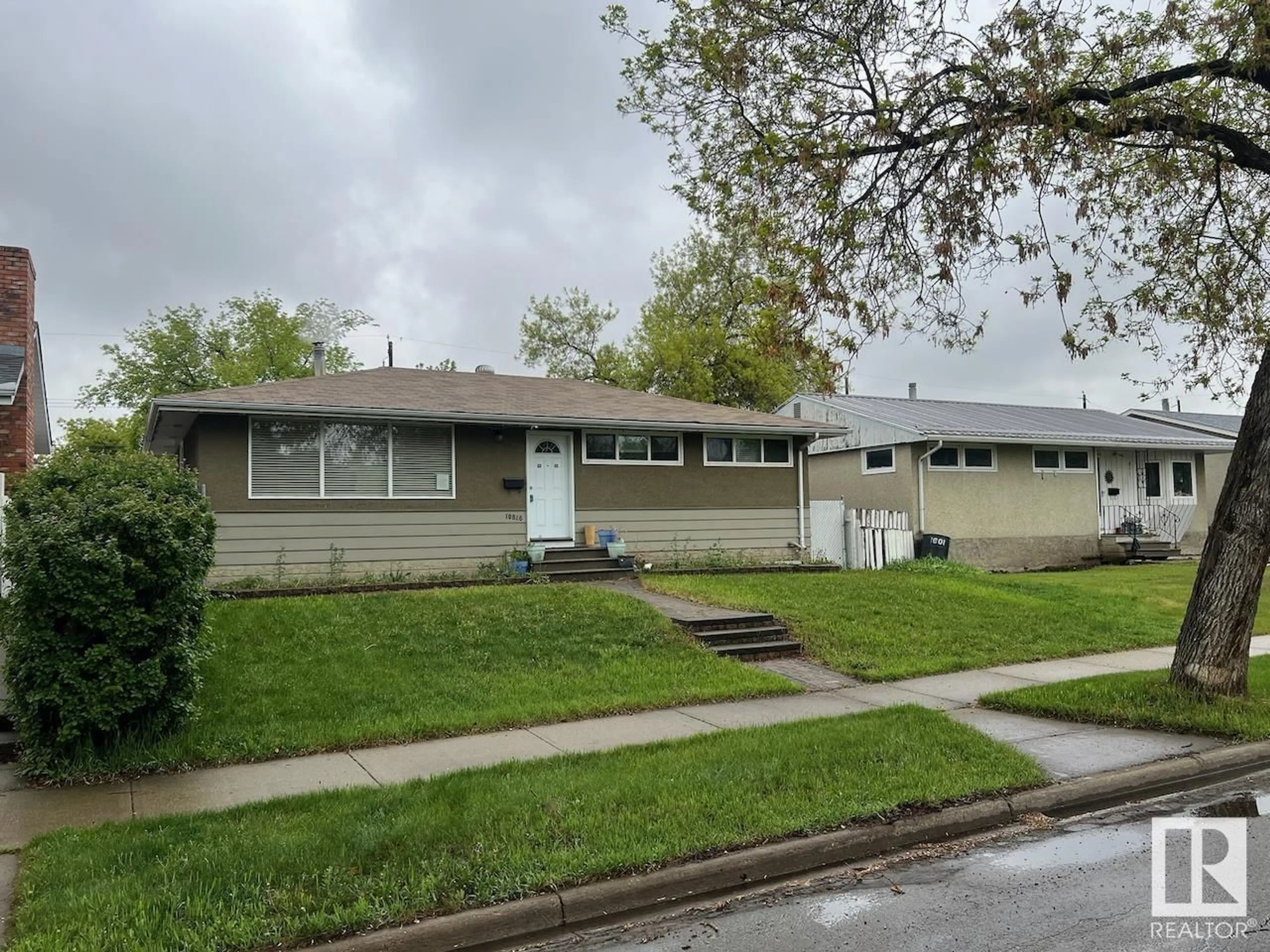 Home with vinyl exterior material, street for NW - 10816 163 ST, Edmonton Alberta T5P3P6