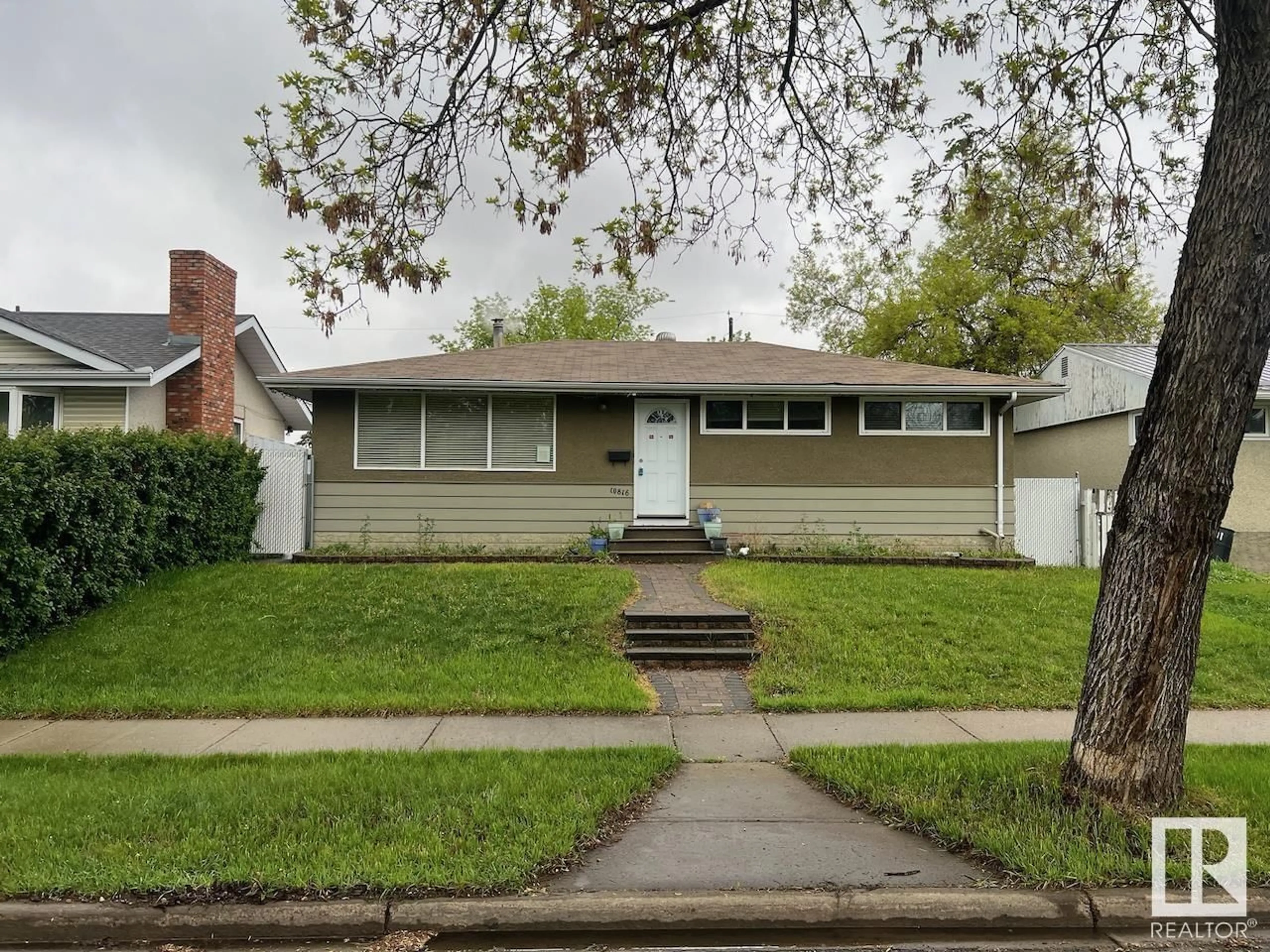 Home with vinyl exterior material, street for NW - 10816 163 ST, Edmonton Alberta T5P3P6