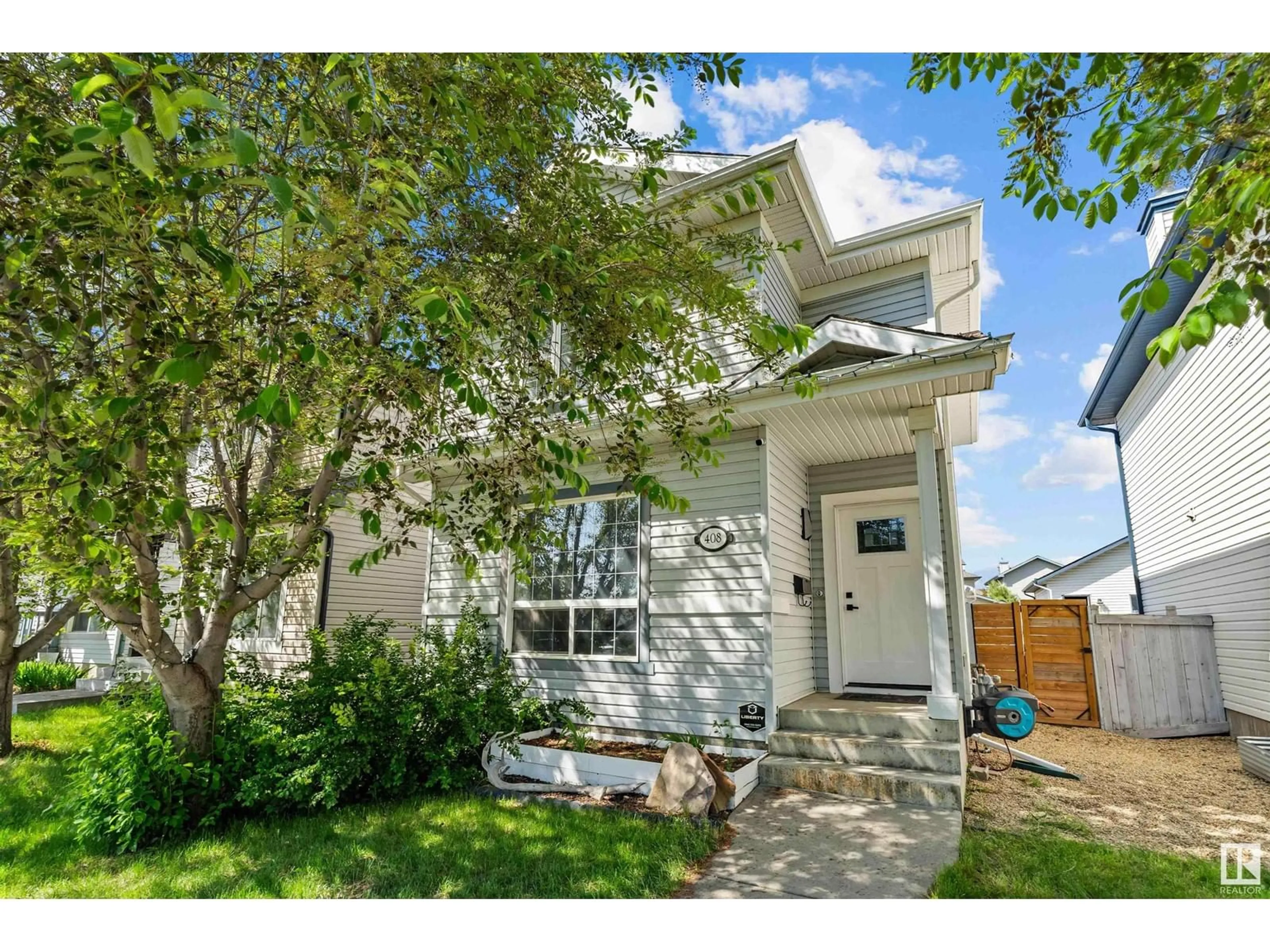 Home with vinyl exterior material, street for 408 GIBB WD, Edmonton Alberta T5T6W8