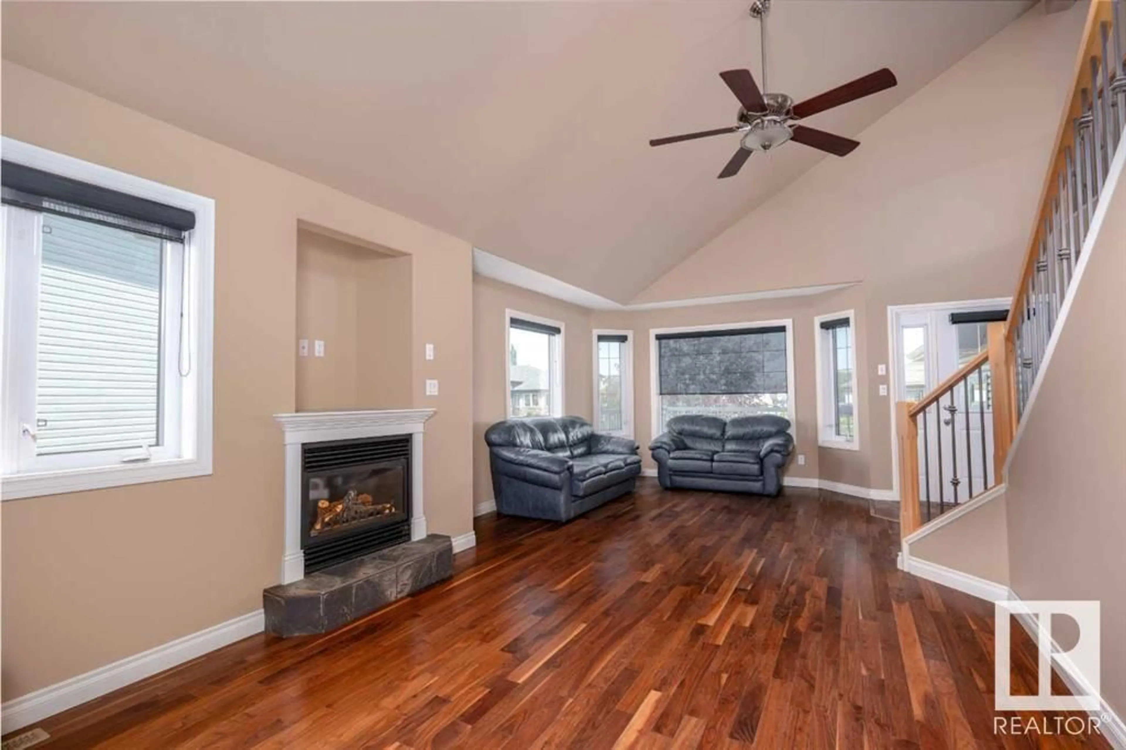 Living room with furniture, wood/laminate floor for 3712 69 ST, Camrose Alberta T4V5B7