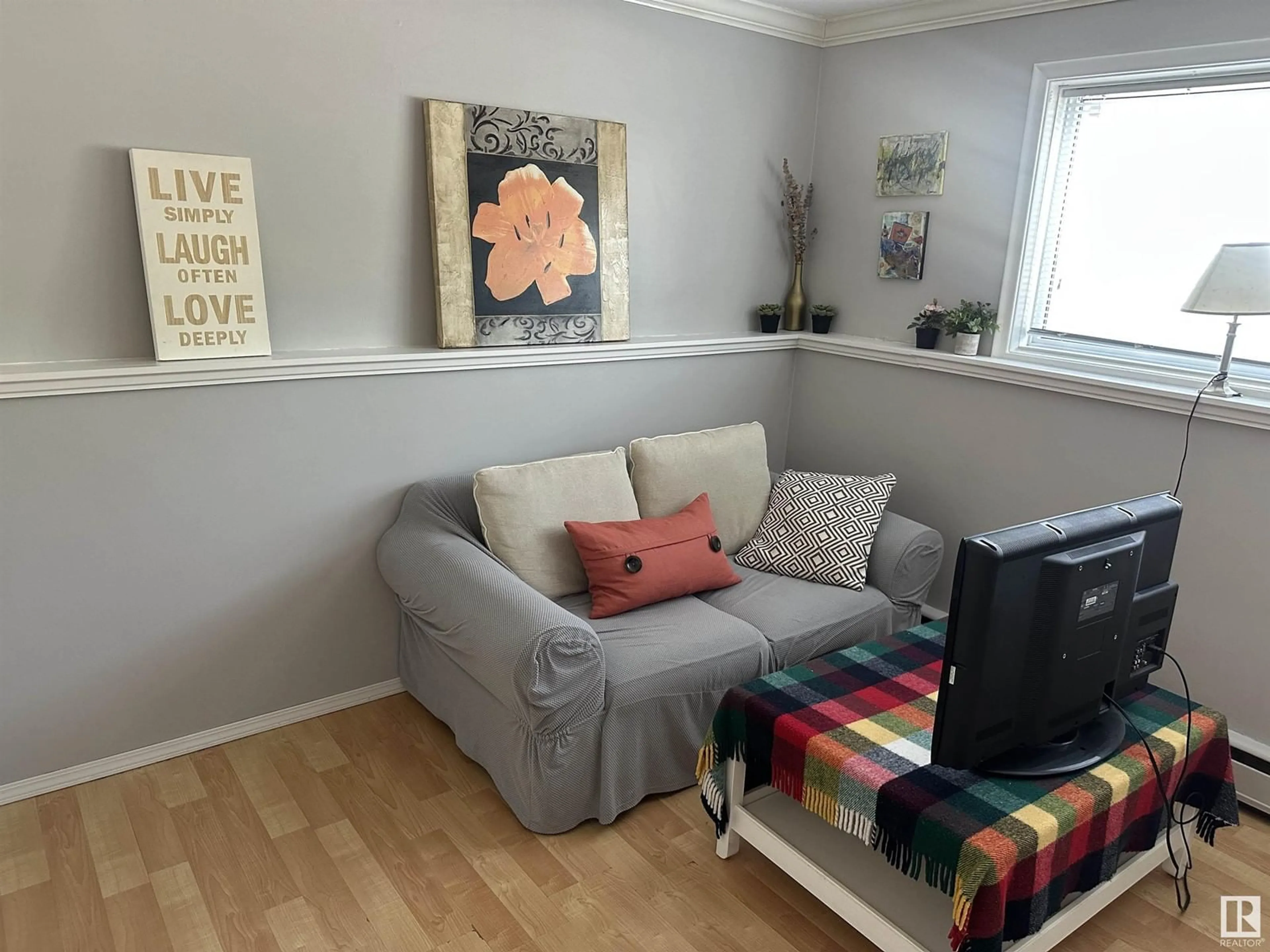Living room with furniture, wood/laminate floor for #2 - 8304 107 ST, Edmonton Alberta T6E4K7