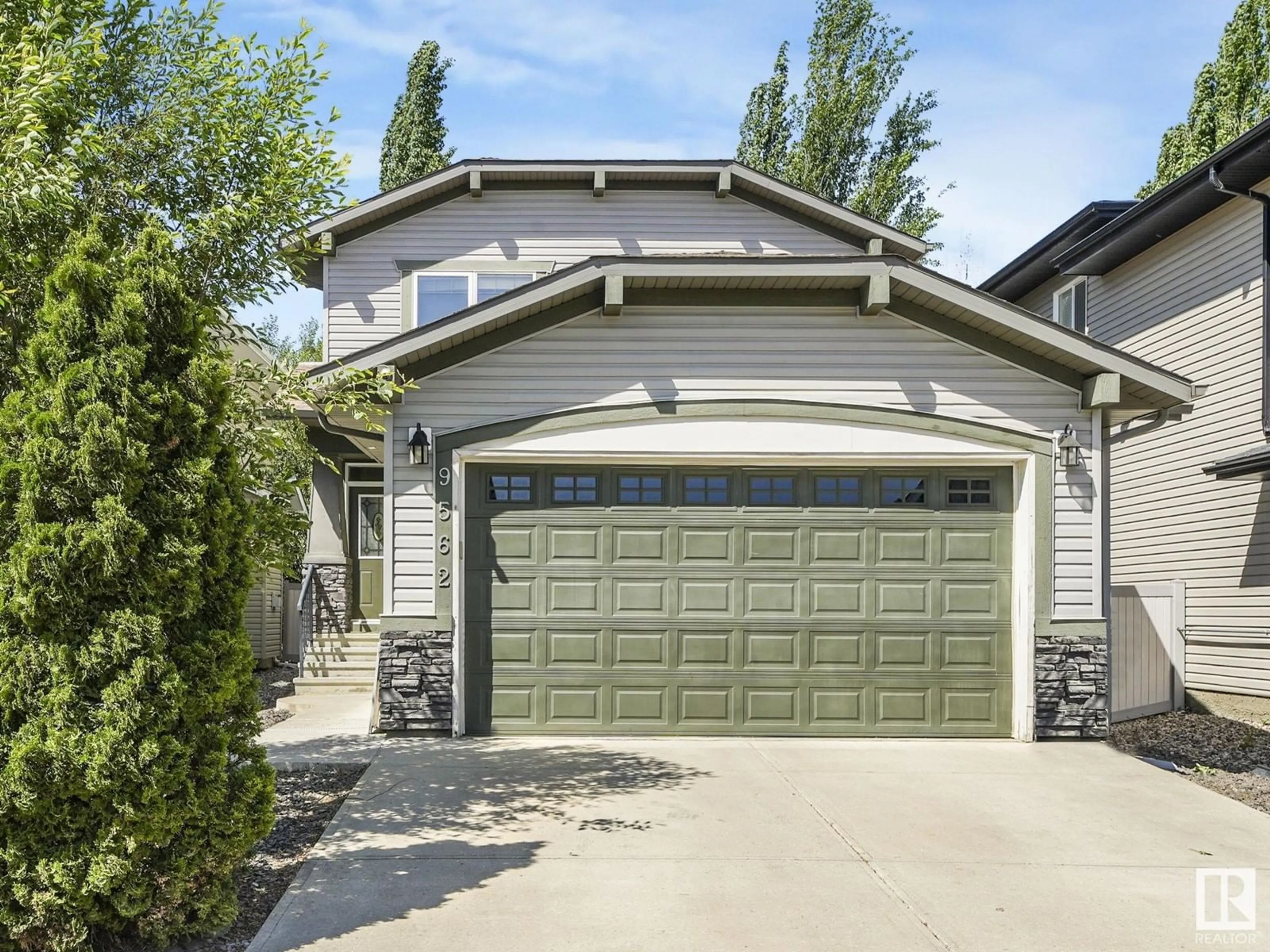 Home with vinyl exterior material, street for 9562 219A ST, Edmonton Alberta T5T4A9