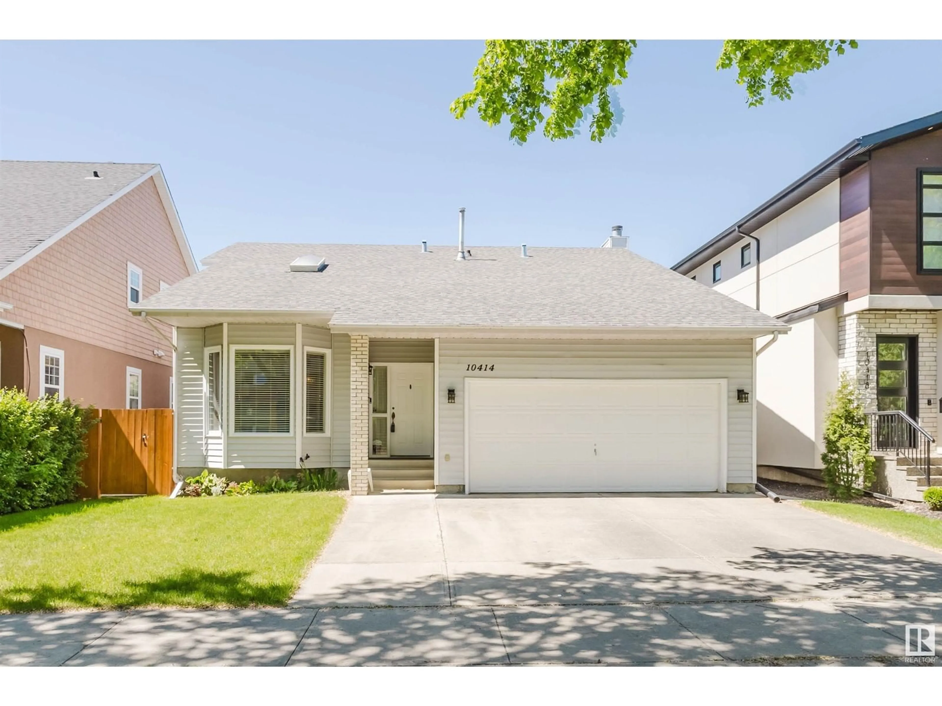 Home with vinyl exterior material, street for NW - 10414 138 ST, Edmonton Alberta T5N2J4