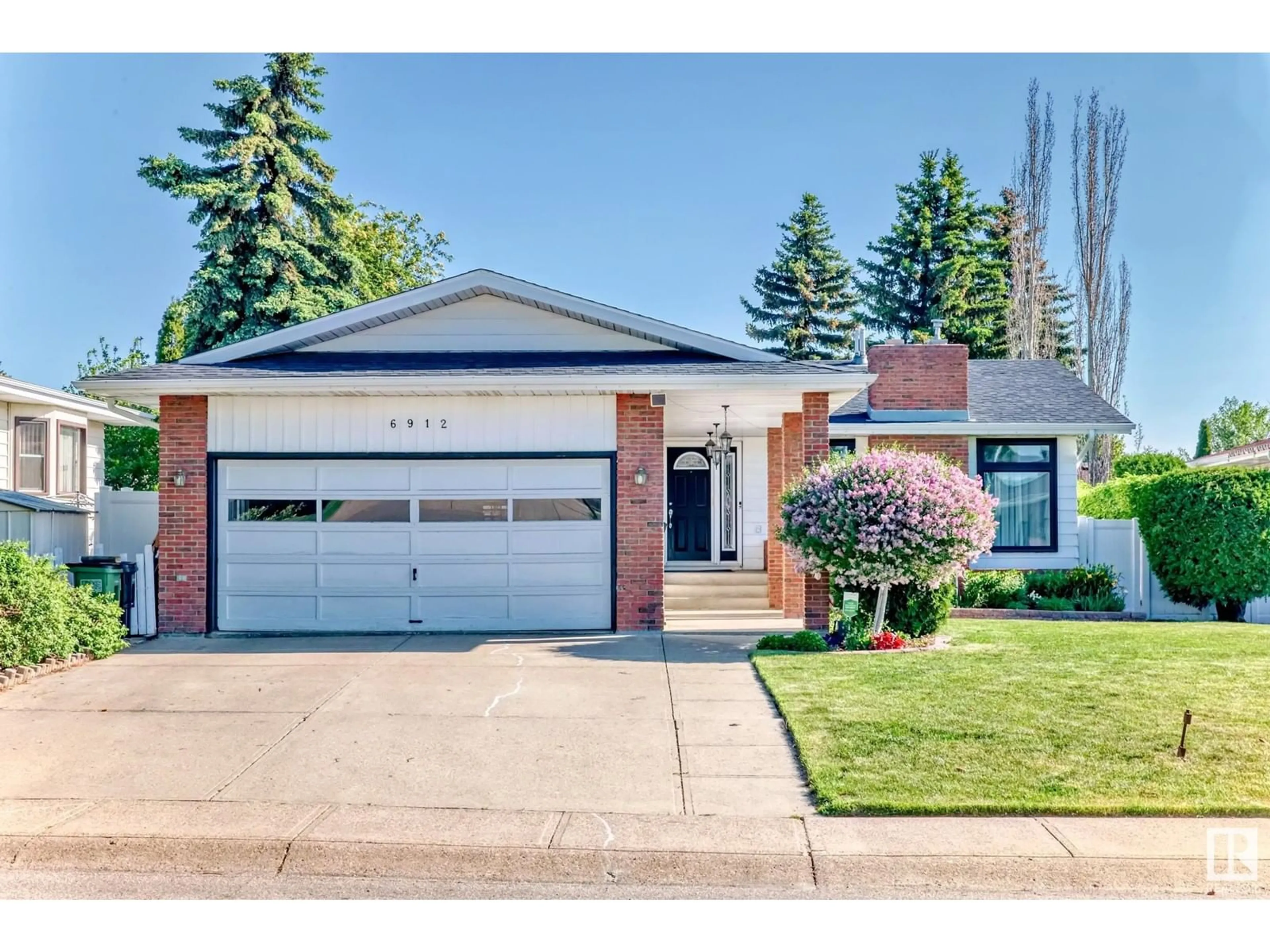 Home with brick exterior material, street for 6912 21 AV, Edmonton Alberta T6K2H4