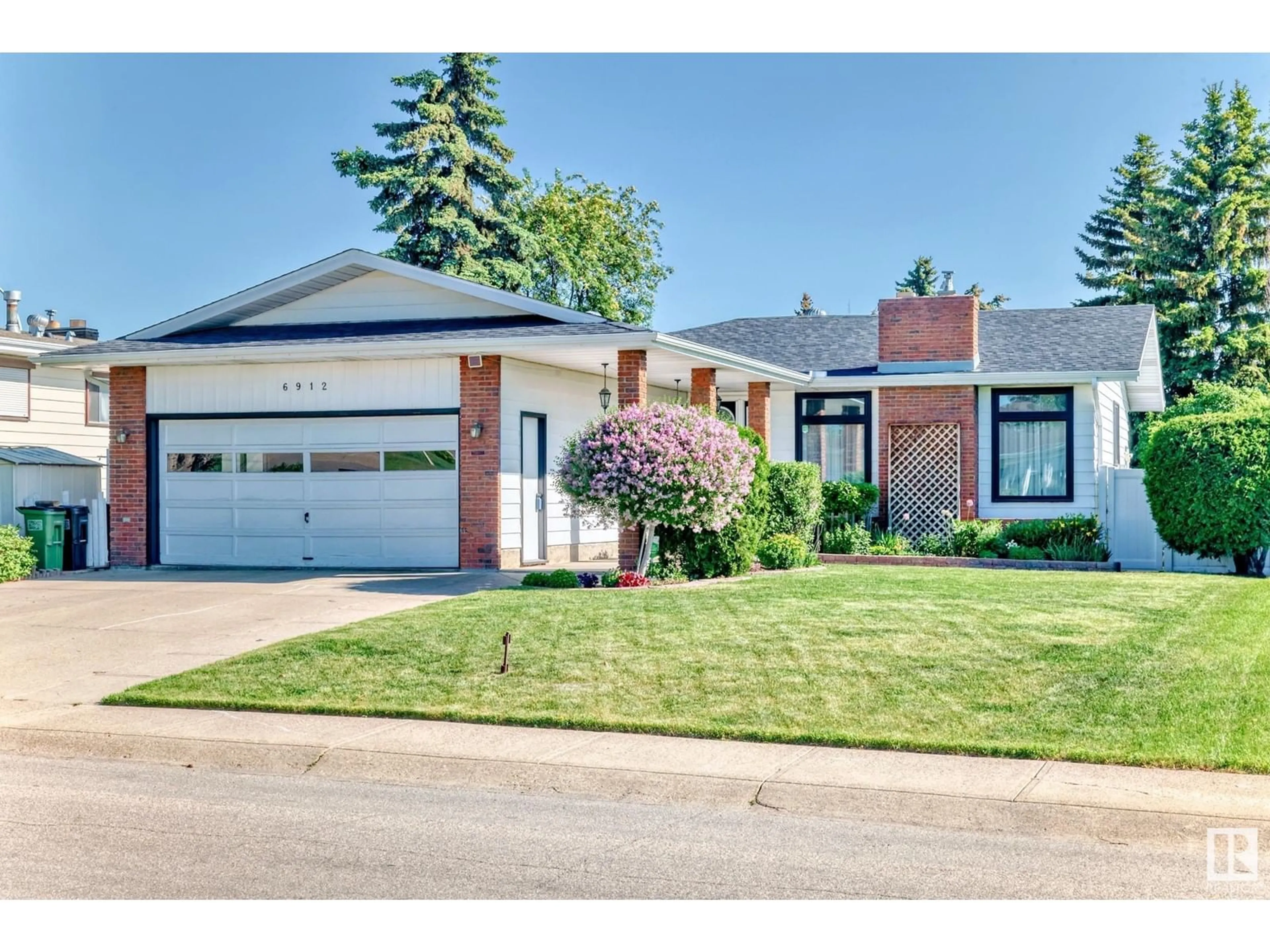 Home with brick exterior material, street for 6912 21 AV, Edmonton Alberta T6K2H4