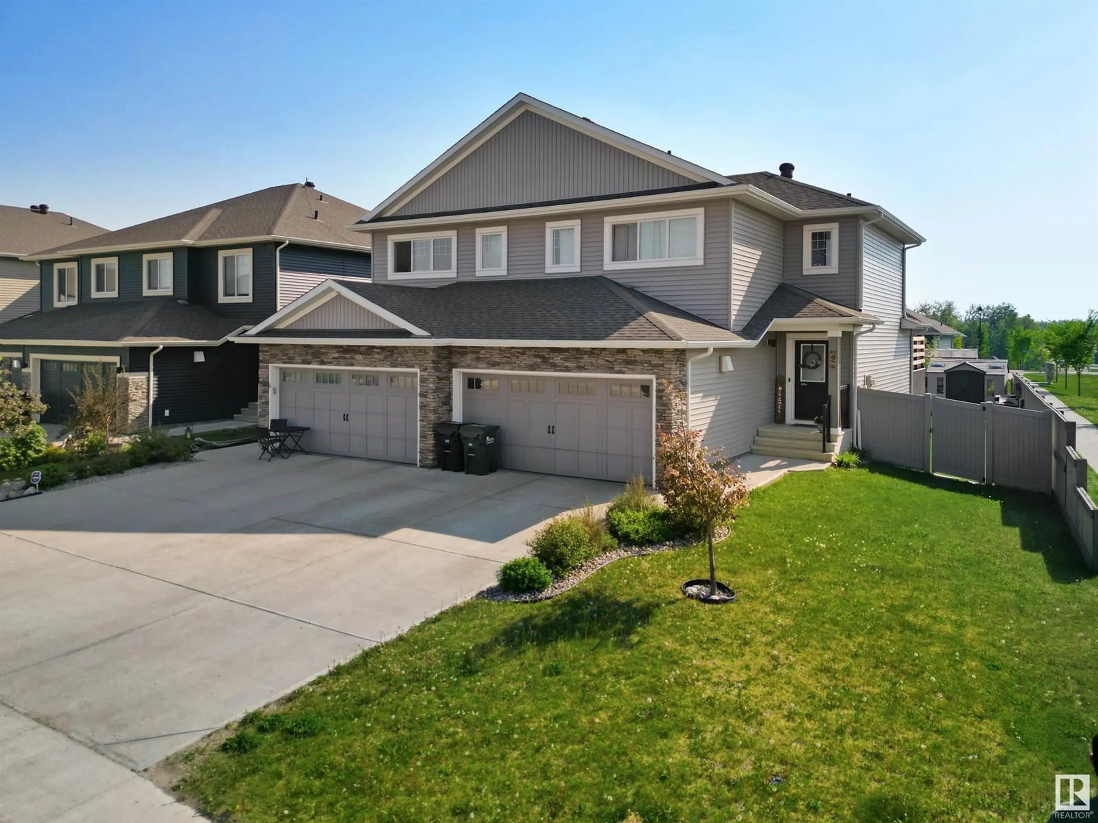 A pic from outside/outdoor area/front of a property/back of a property/a pic from drone, street for 2 RANCHER RD, Ardrossan Alberta T8A0A2