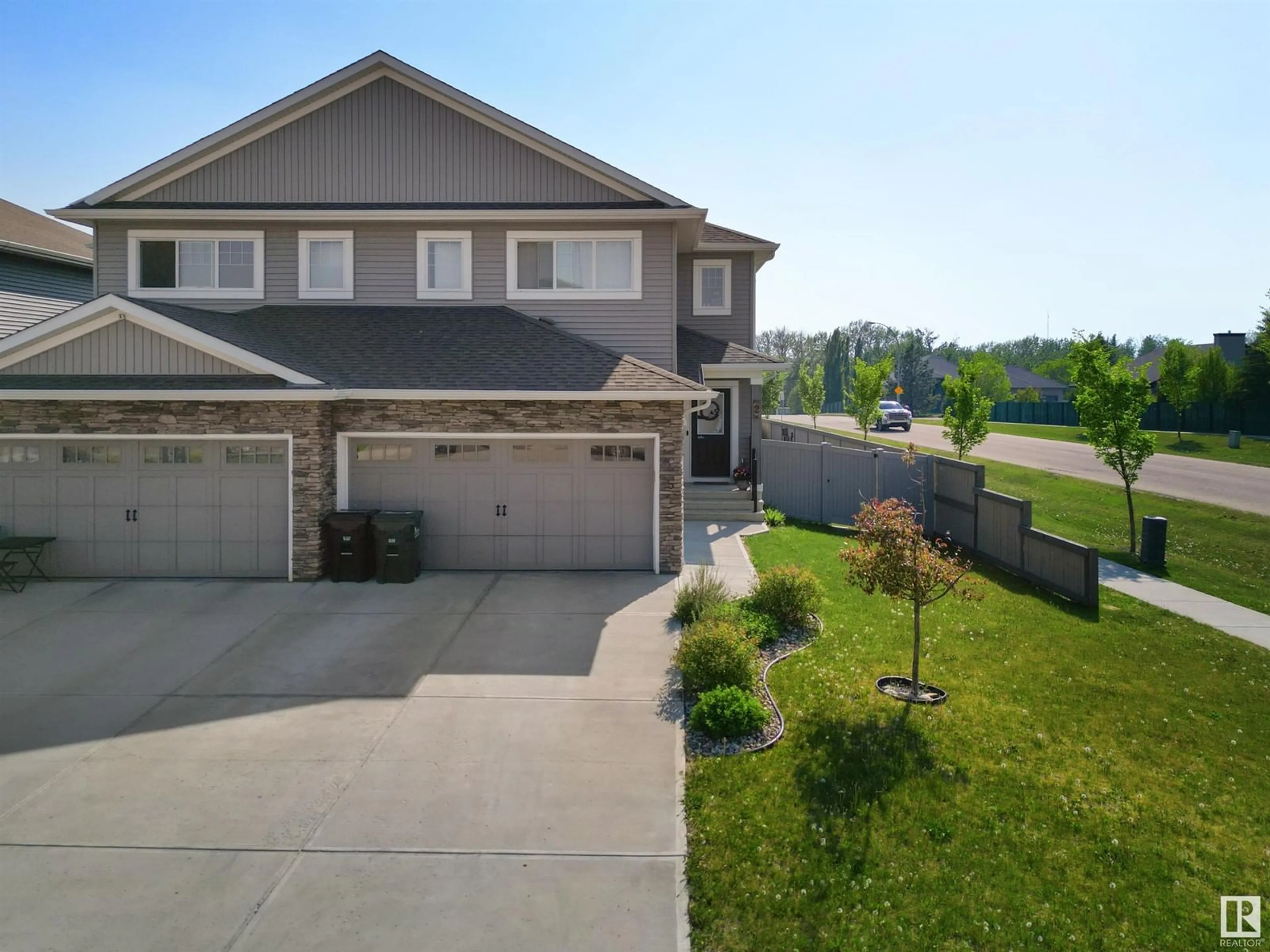 A pic from outside/outdoor area/front of a property/back of a property/a pic from drone, street for 2 RANCHER RD, Ardrossan Alberta T8A0A2