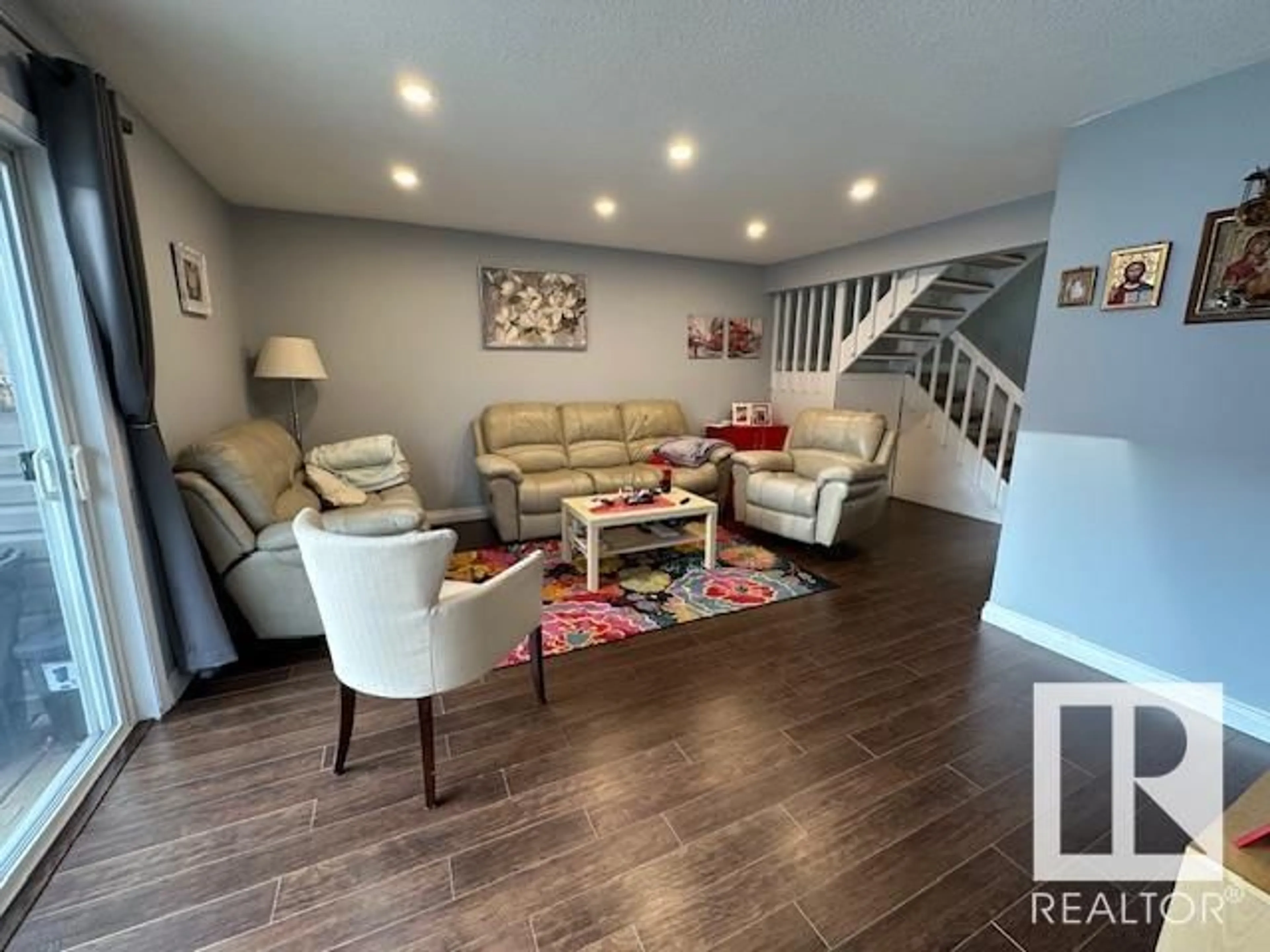 Living room with furniture, wood/laminate floor for NW NW - 4C MEADOWLARK VG, Edmonton Alberta T5R5X3