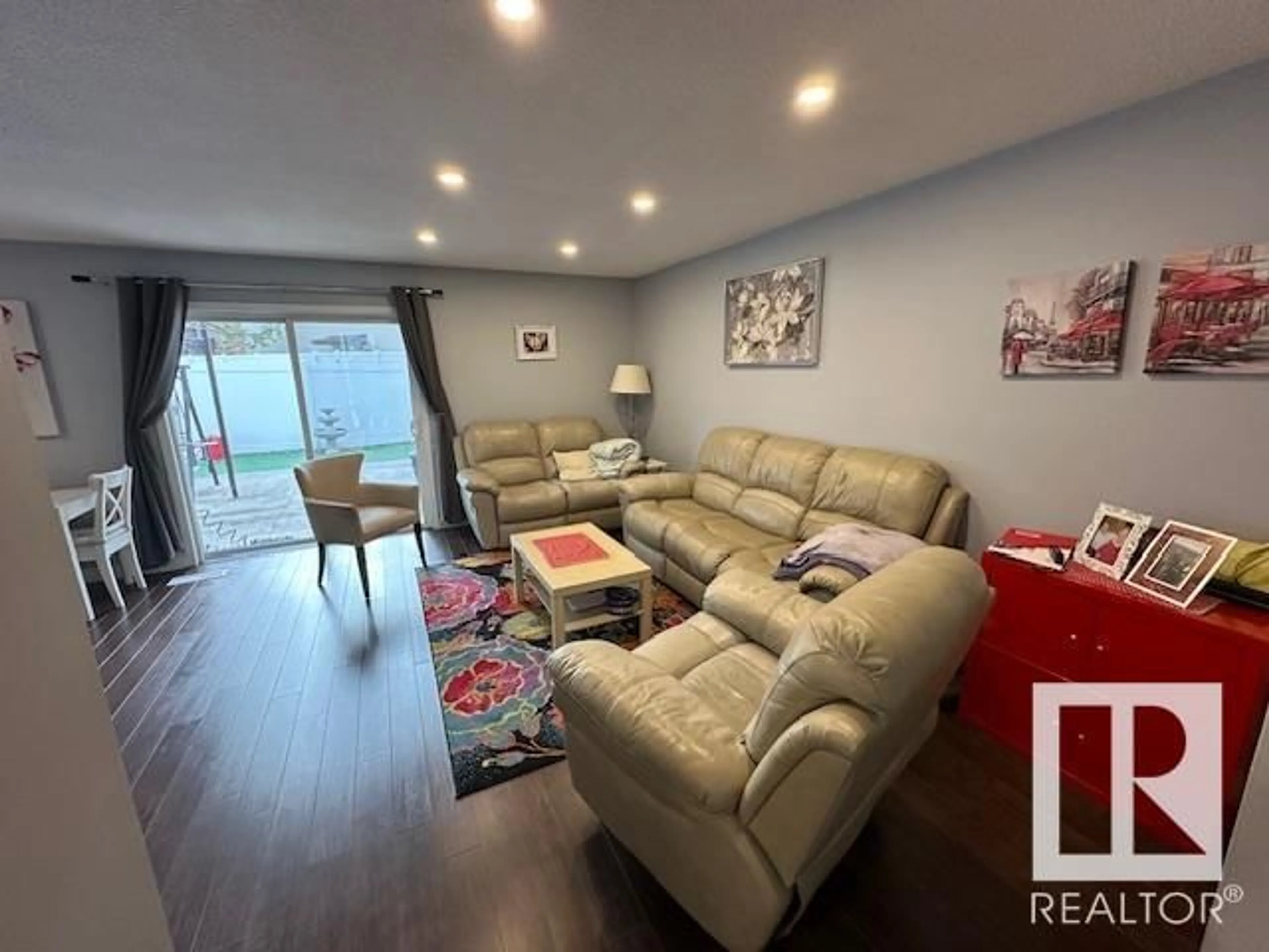 Living room with furniture, wood/laminate floor for NW NW - 4C MEADOWLARK VG, Edmonton Alberta T5R5X3